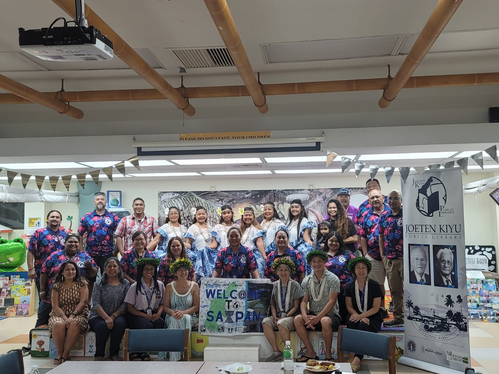 Workshop participants pose for a photo during  a welcoming dinner at JKPL.