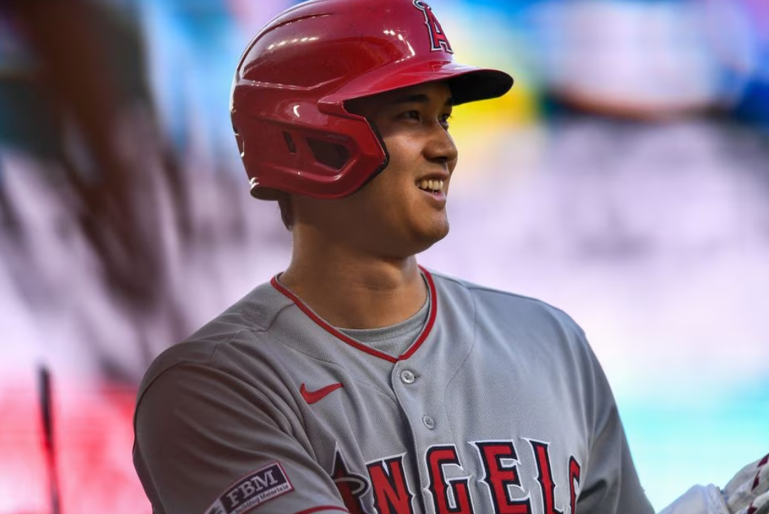 Los Angeles Angels designated hitter Shohei Ohtani (17) smiles as he stands in the on deck circle in the first inning against the Colorado Rockies at Coors Field in Denver, Colorado, June 24, 2023.