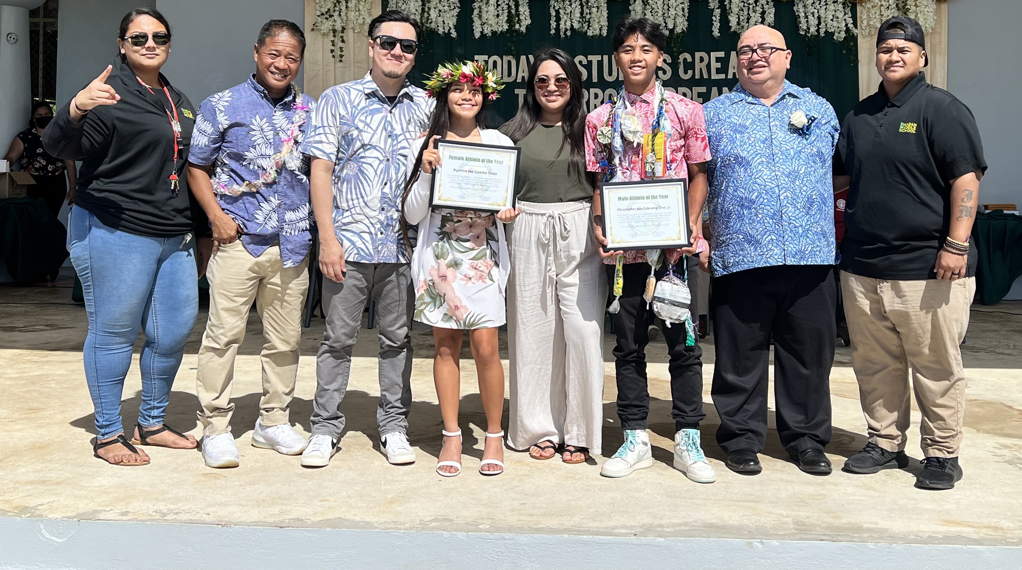 Dandan Middle School  Male Athlete of the Year Christopher Cruz, Jr, and Female Athlete of the Year Ayanna Stole with Principal James Sablan and Vice Principal Reo Arriola, teachers and coaches.