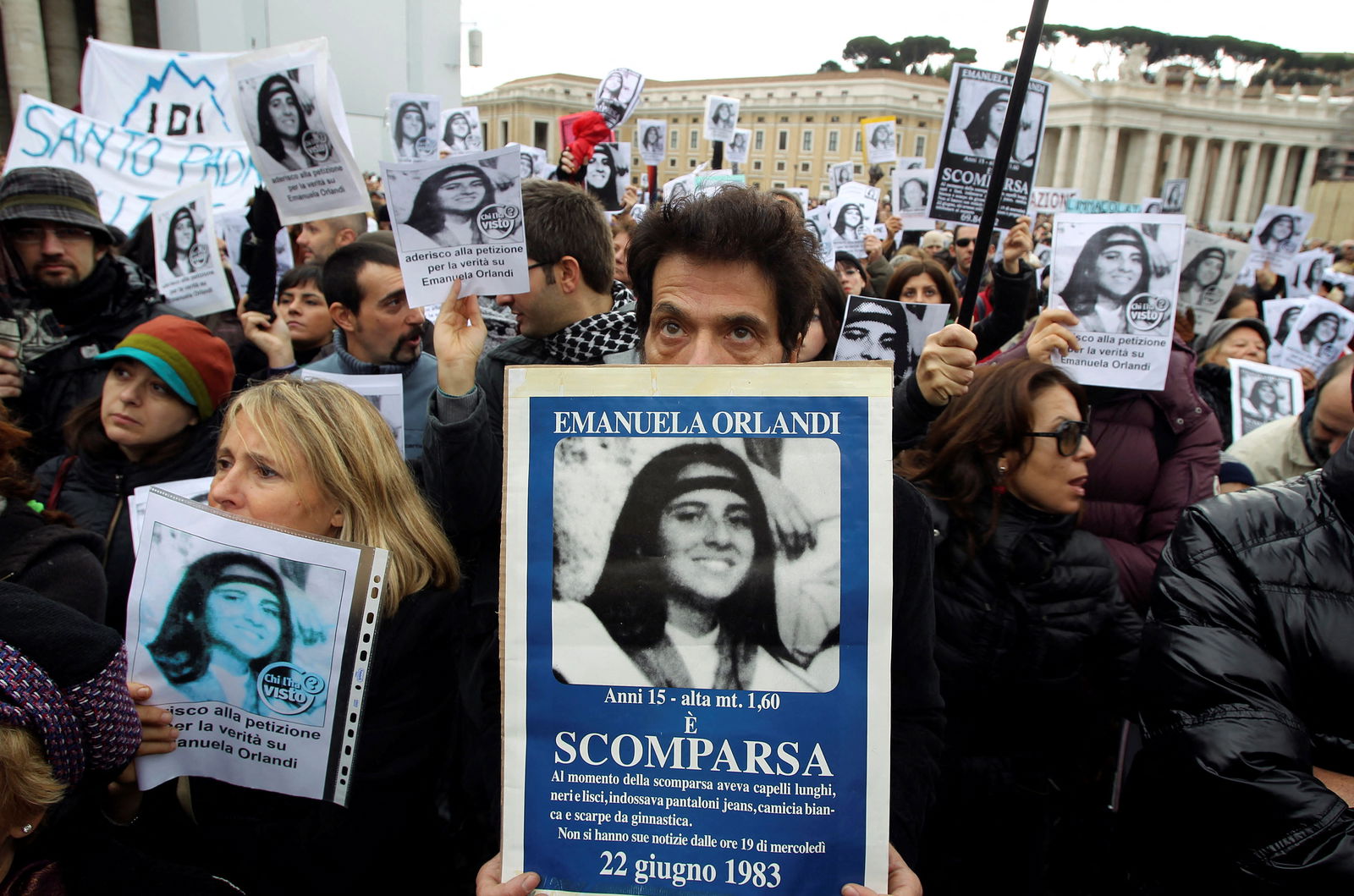 FILE PHOTO: Pietro, brother of Emanuela Orlandi holds a banner with her picture in front of St. Peter square as Pope Benedict XVI leads the angelus prayer December 18, 2011. REUTERS/Stringer/File Photo
