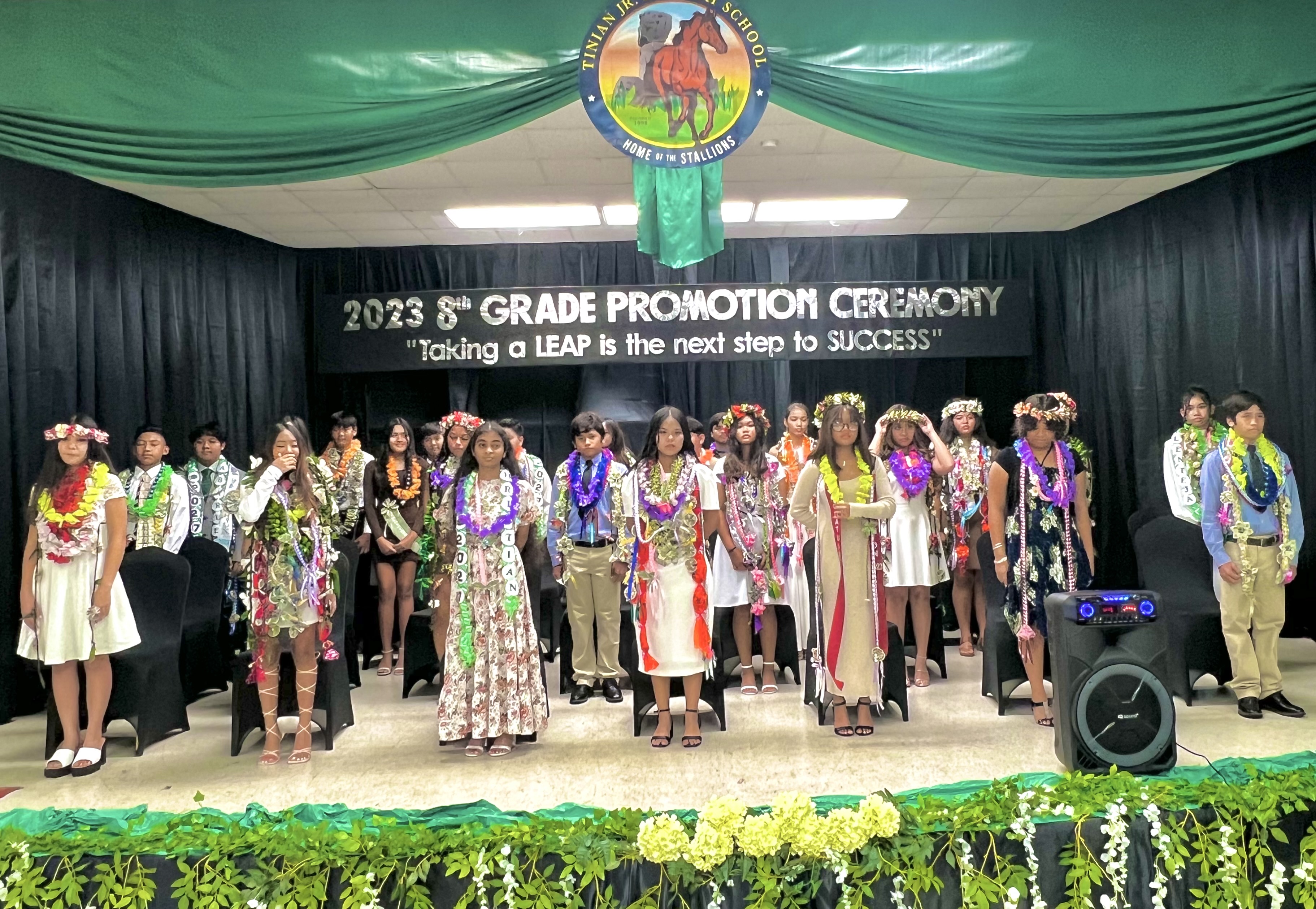 The 28 promoted students of Tinian Junior High School are introduced to the public.