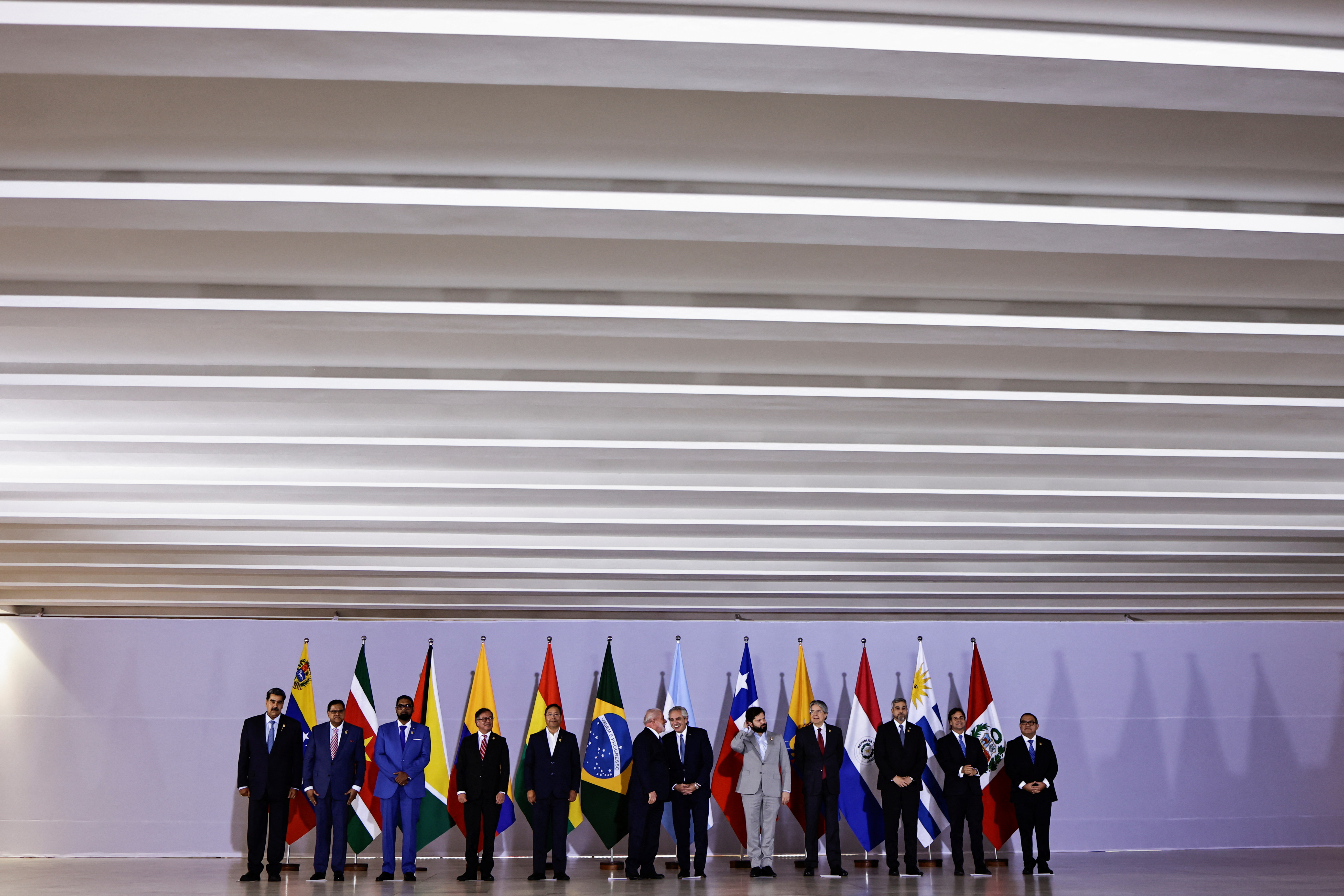 Venezuela's President Nicolas Maduro, Suriname's President Chan Santokhi, Guyana's President Mohamed Irfaan Ali, Colombia's President Gustavo Petro, Bolivia's President Luis Arce, Brazil's President Luiz Inacio Lula da Silva, Argentinian President Alberto Fernandez, Chilean President Gabriel Boric, Ecuador's President Guillermo Lasso, Paraguay's President Mario Abdo Benitez, Uruguay's President Luis Lacalle Pou and Peruvian Prime Minister Alberto Otarola pose for official photo during the South American Summit at Itamaraty Palace in Brasilia, Brazil May 30, 2023. REUTERS/Ueslei Marcelino