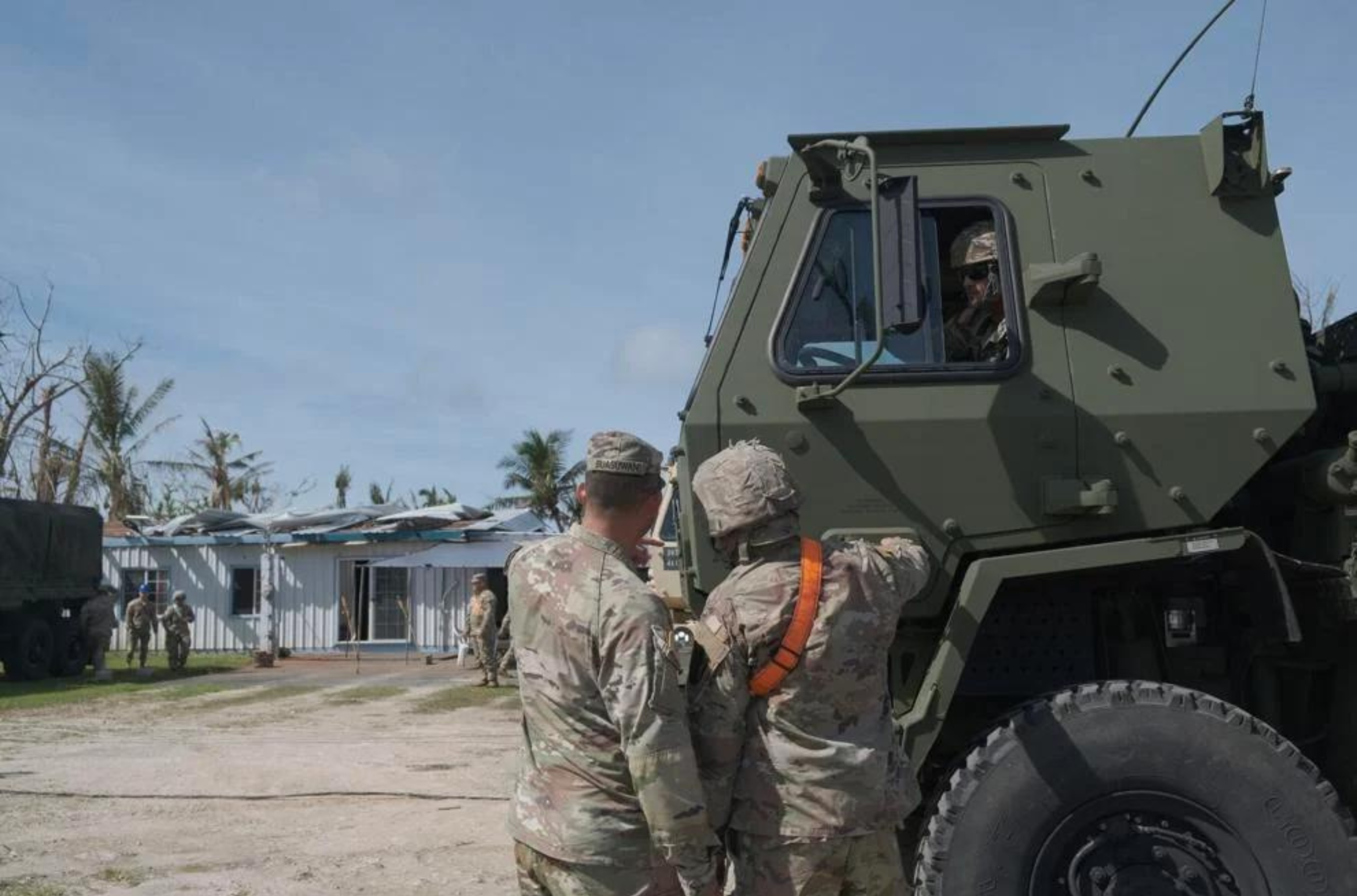 Members of Task Force West park military vehicles at the residence of Beccalyn and Kelvin Torres as part of the RISE UP program in Dededo on Saturday, June 10, 2023. 