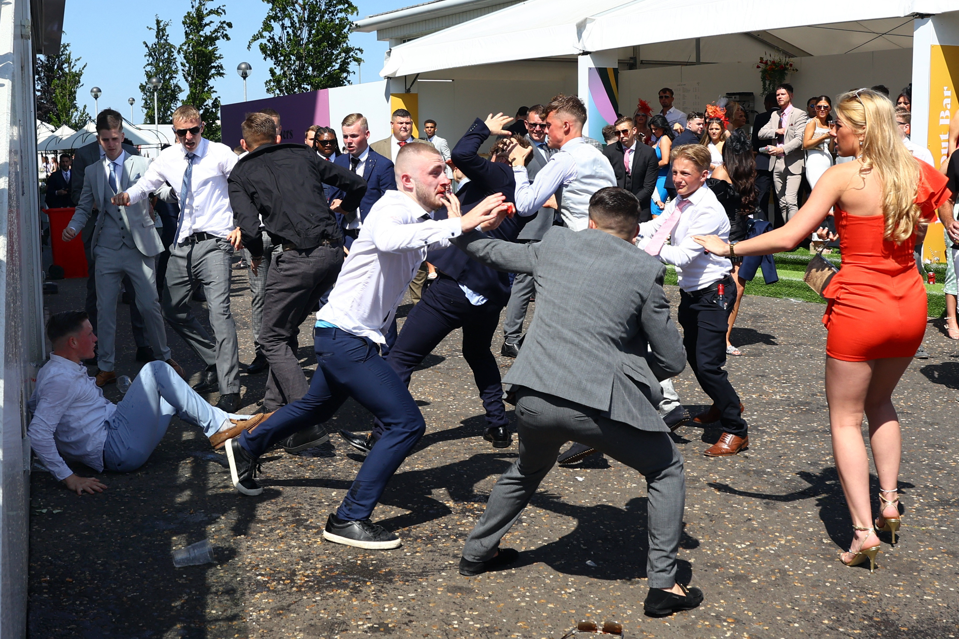 Horse Racing - Epsom Derby Festival - Epsom Downs Racecourse, Epsom, Britain - June 2, 2023 Racegoers clash at the Epsom Derby Festival Action Images via Reuters/Matthew Childs