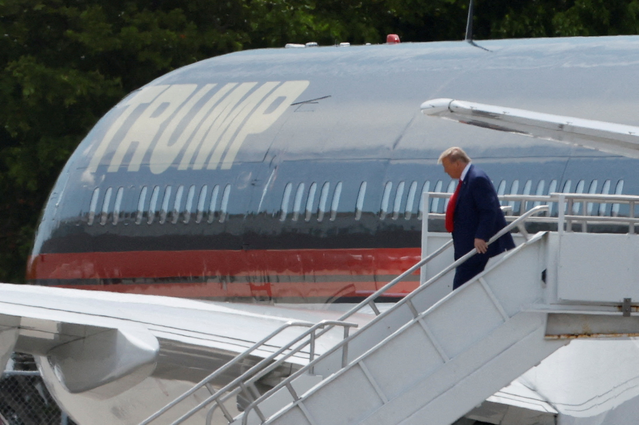 Former U.S. President Donald Trump arrives at Miami International Airport as he is to appear in a federal court on classified document charges, in Miami, Florida, U.S., June 12, 2023. REUTERS/Marco Bello