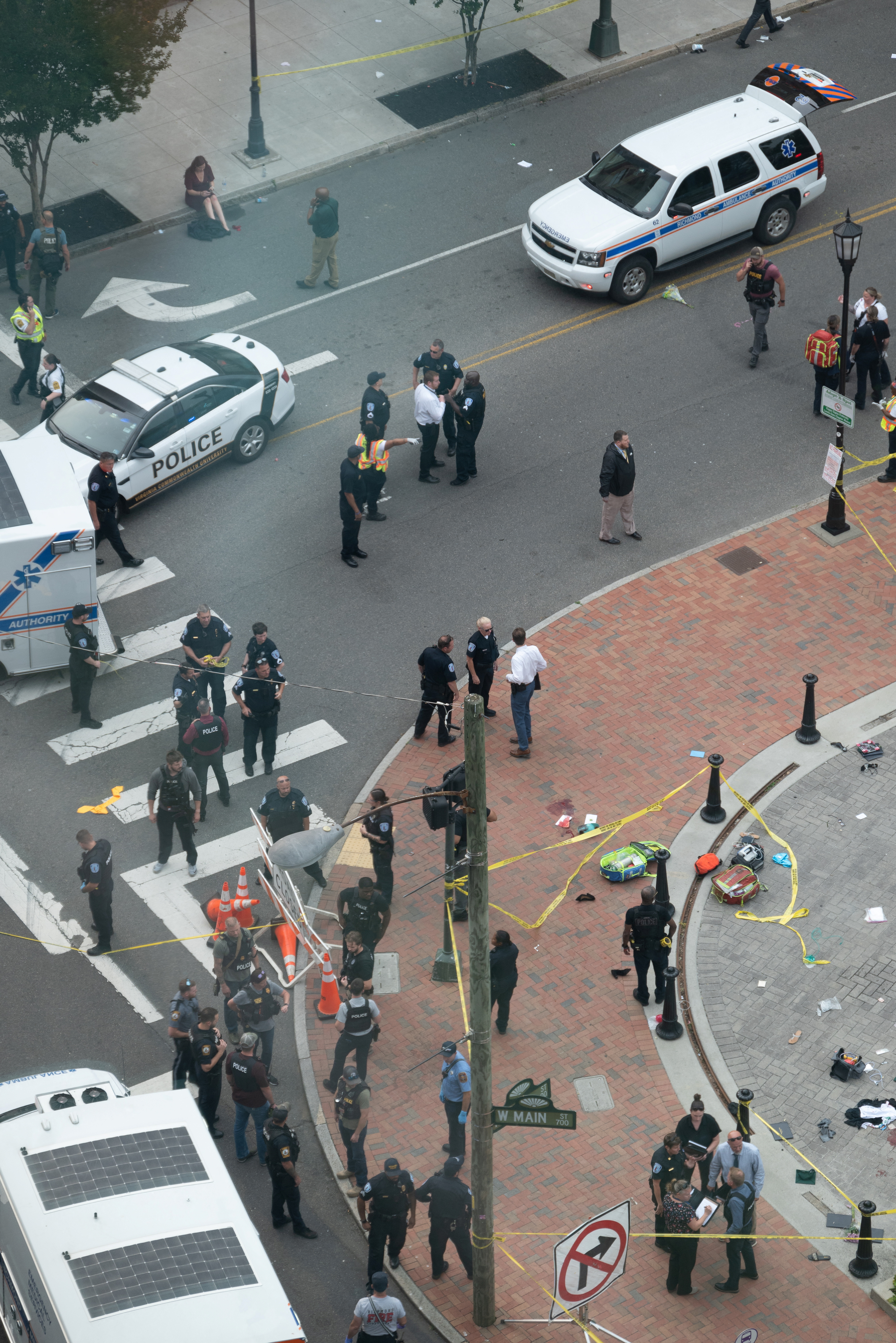 Law enforcement officers investigate at the scene after a gunman opened fire in a park as high school graduates and their families emerged from a theater where commencement exercises had just concluded, in Richmond, Virginia, U.S. June 6, 2023 in this picture obtained from social media. Clark Frierson/Instagram @by.esign/via REUTERS