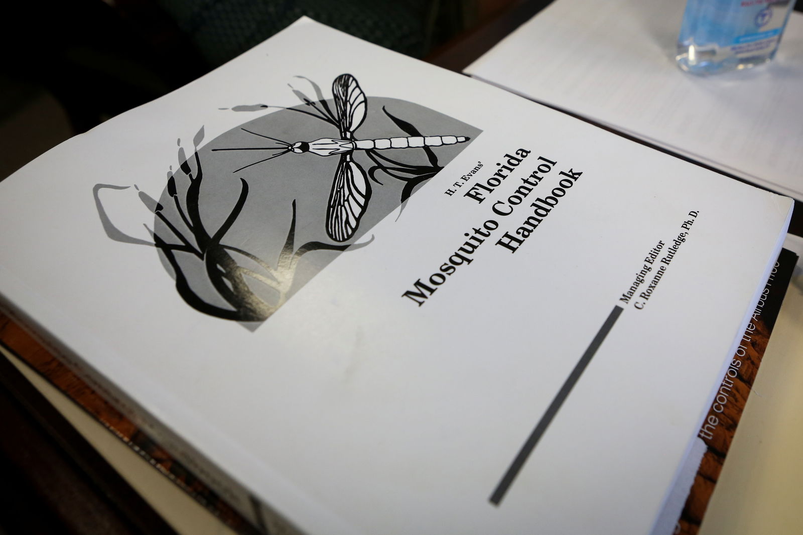 A handbook is seen at Florida Keys Mosquito Control District headquarters, in Marathon, Florida, U.S. May 4, 2021. Picture taken May 4, 2021. REUTERS/Marco Bello/File Photo