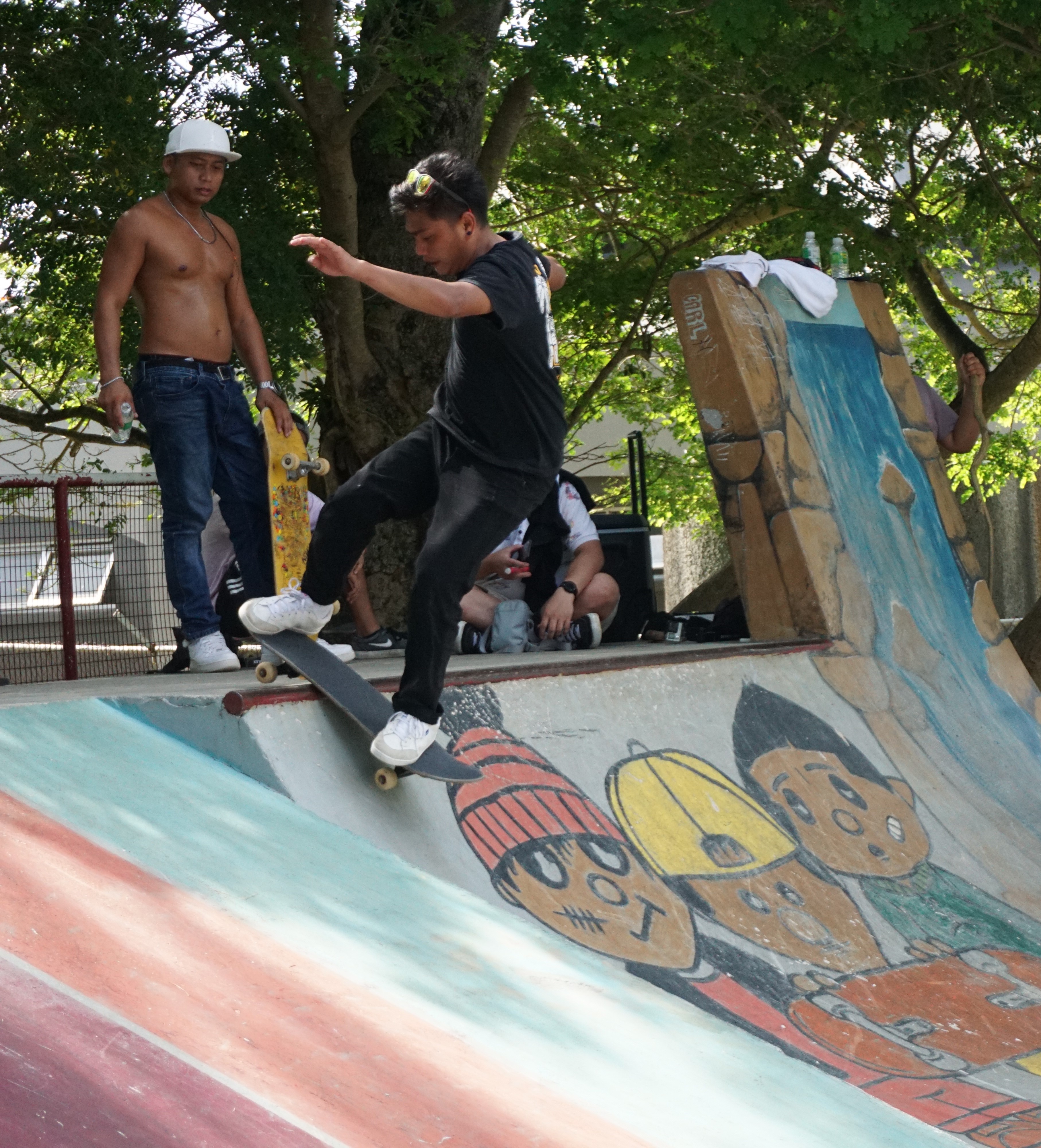 Kevin Codog grinds through the edge of the ramp during the 1st annual Marianas Skate Series at Garapan Skate Park on Saturday. 