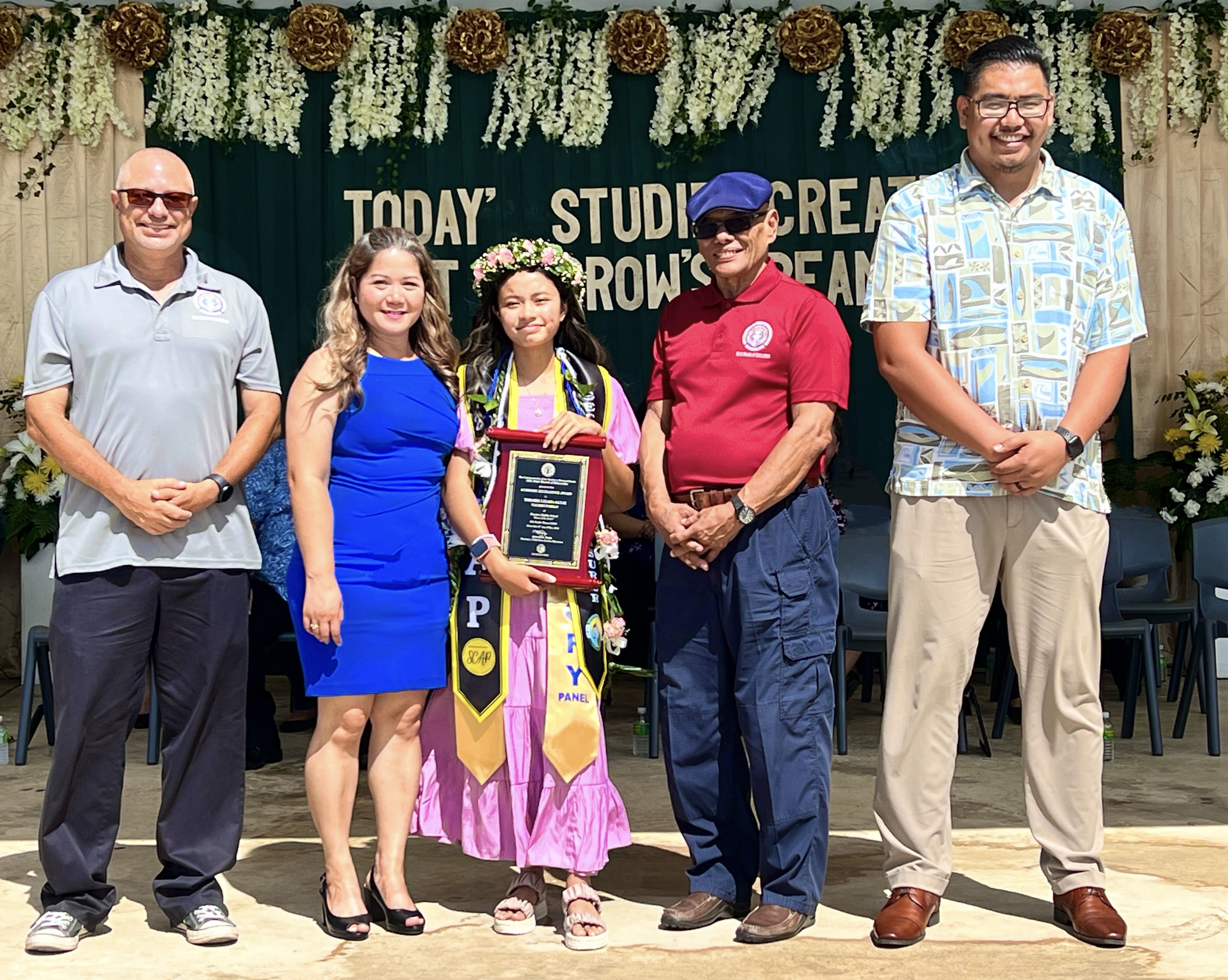 Class Valedictorian and Board of Education Academic Excellence Award recipient Ysharei Sanje, center, poses for a photo with her mother, Arlene Lizama, the Public School System’s budget and finance director,  BOE Chairman Antonio L. Borja, Vice Chairman Herman Atalig and Secretary/Treasurer Gregory Pat. Borja. (More photos on pages 14-15)