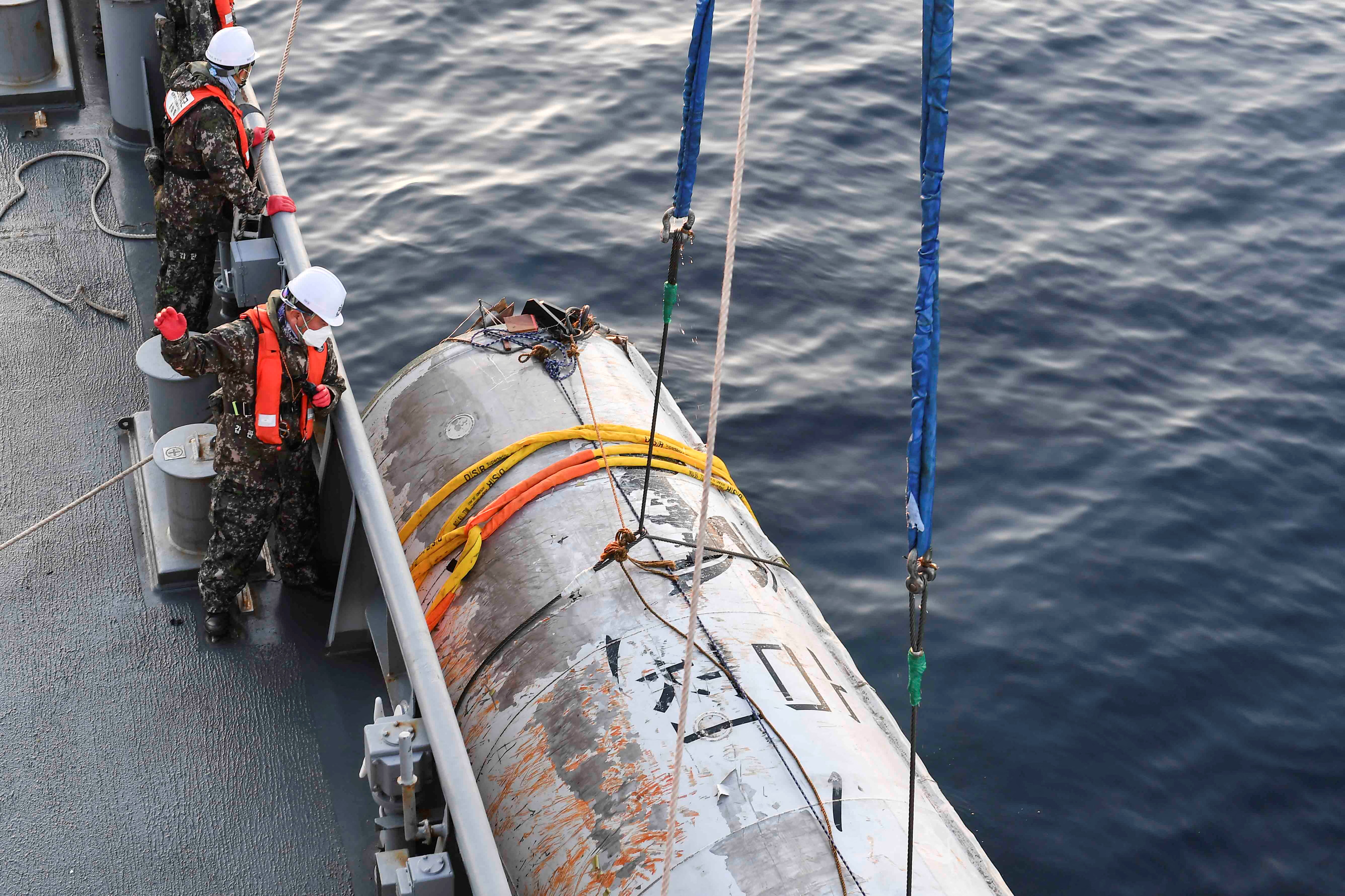 A handout picture shows a part of what is believed to be a space launch vehicle that North Korea said crashed into the sea off the west coast of the divided peninsula, and which the South Korean military had salvaged, at an unidentified location in South Korea, June 15, 2023. The Defense Ministry/Handout via REUTERS