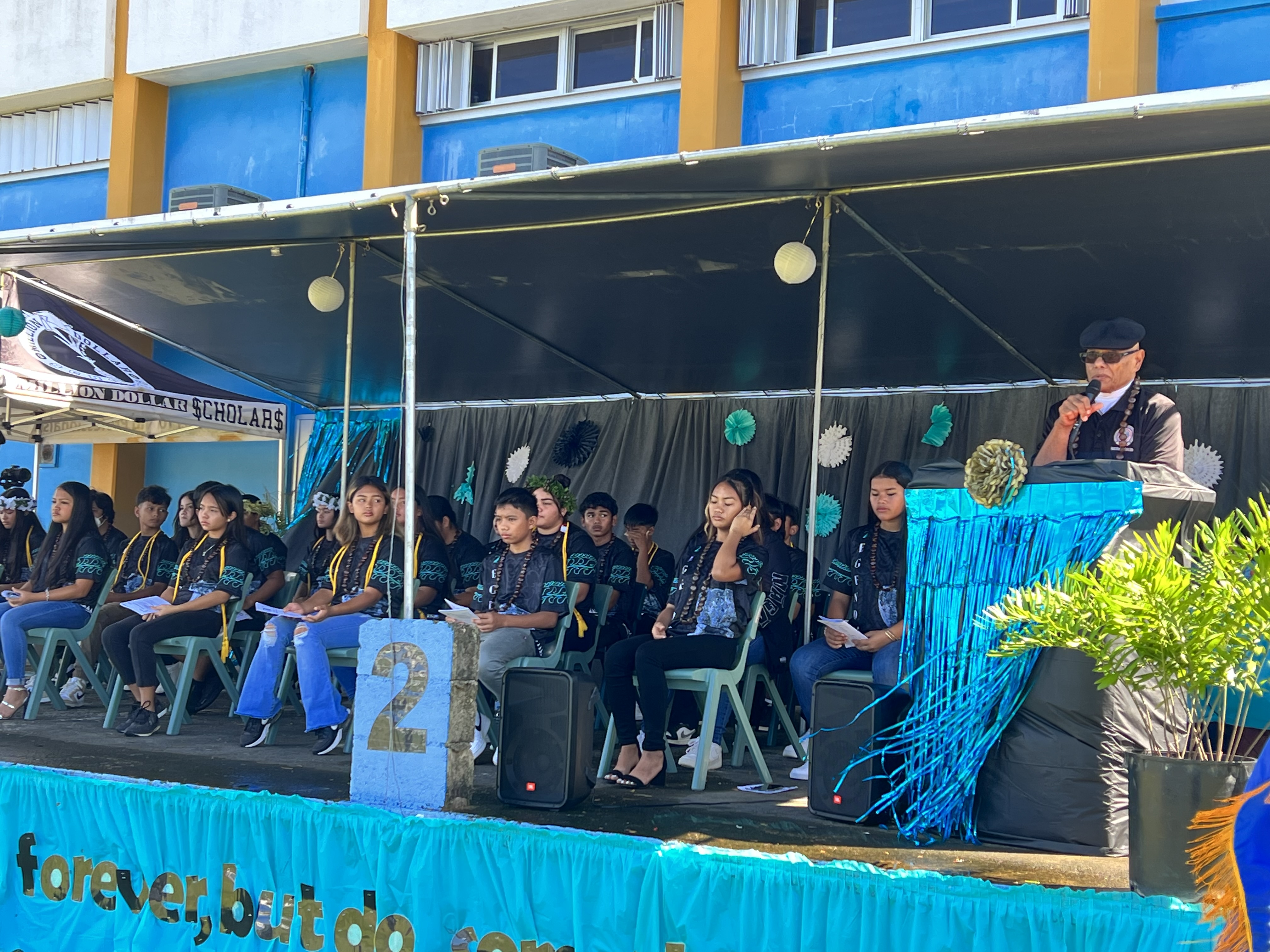 Board of Education Vice Chairman Herman Atalig of Rota speaks to the promoted students.