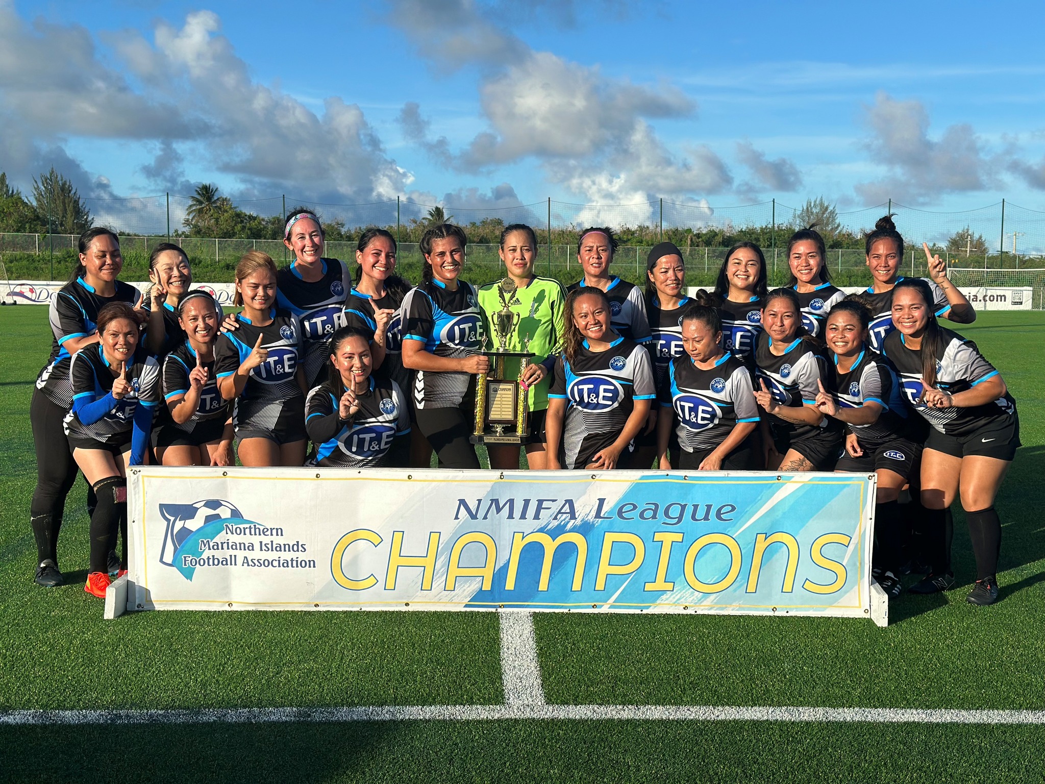 MP United Football Club members pose with the Flores-Pee Luwal (Intermediate) Division trophy after defeating the Southern United Football Club in the championship match of the Dove Women's League at the NMI Soccer Training Center in Koblerville on Sunday.