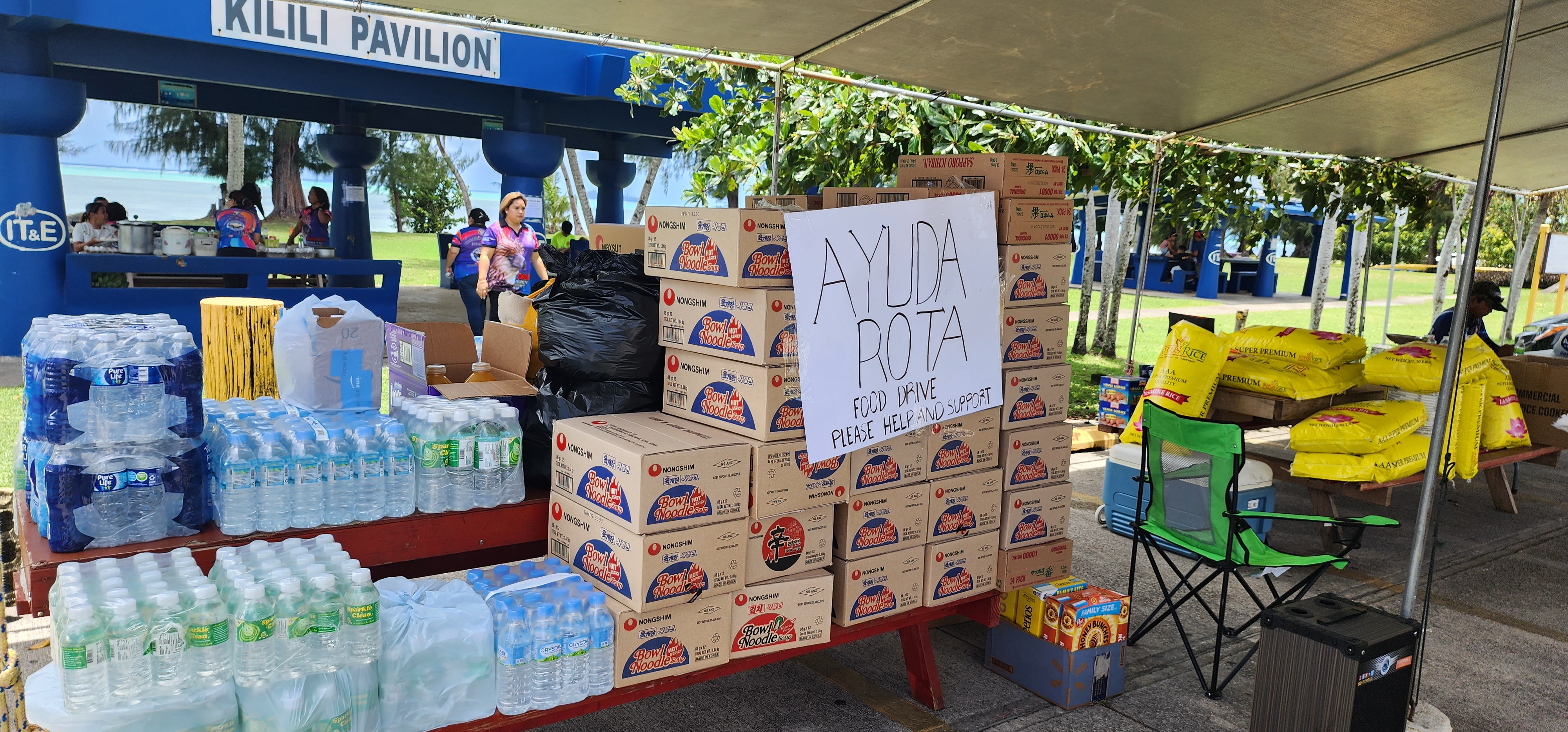 The donated items for the Ayuda Rota Food Drive include rice, bottles of water, butane canisters and other grocery items.