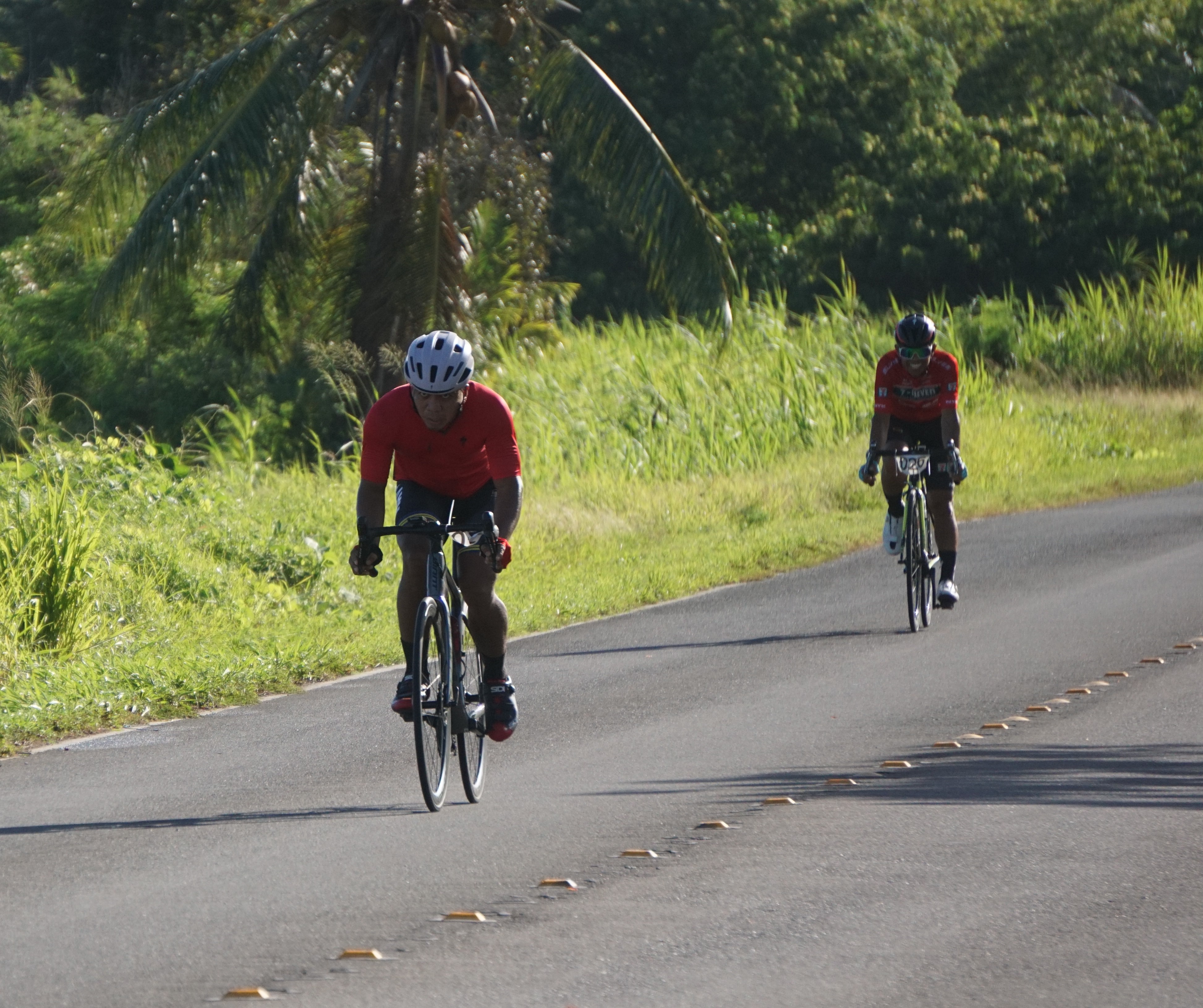Rolando Gacayan, foreground, approaches the finish line with Joel Buco trailing behind during the first race of the Hell of the Marianas 2023 series Sunday in Marpi.