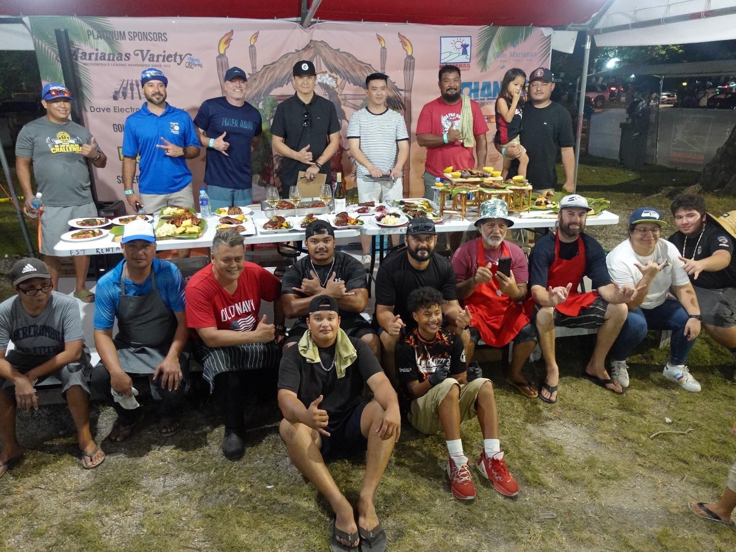Contestants, organizers, and judges take a commemorative photo at Budweiser’s King of the Grill contest during the 24th Annual Taste of the Marianas International Food Festival & Beer Garden on June 17, 2023, at Garapan Fishing Base, Saipan.   The cook-off challenged both amateur and professional chefs to deliver the best Certified Angus Beef steaks and ribs.