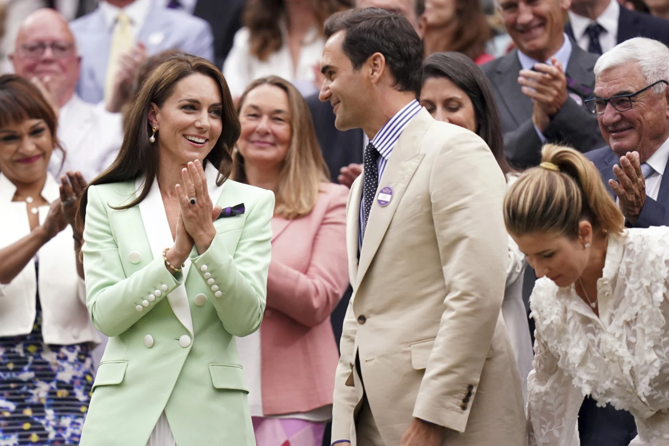 Britain’s Princess of Wales, Kate, left, shares a word with retired tennis champion Roger Federer in the royal box, on day two of the Wimbledon tennis championships in London, Tuesday, July 4, 2023.