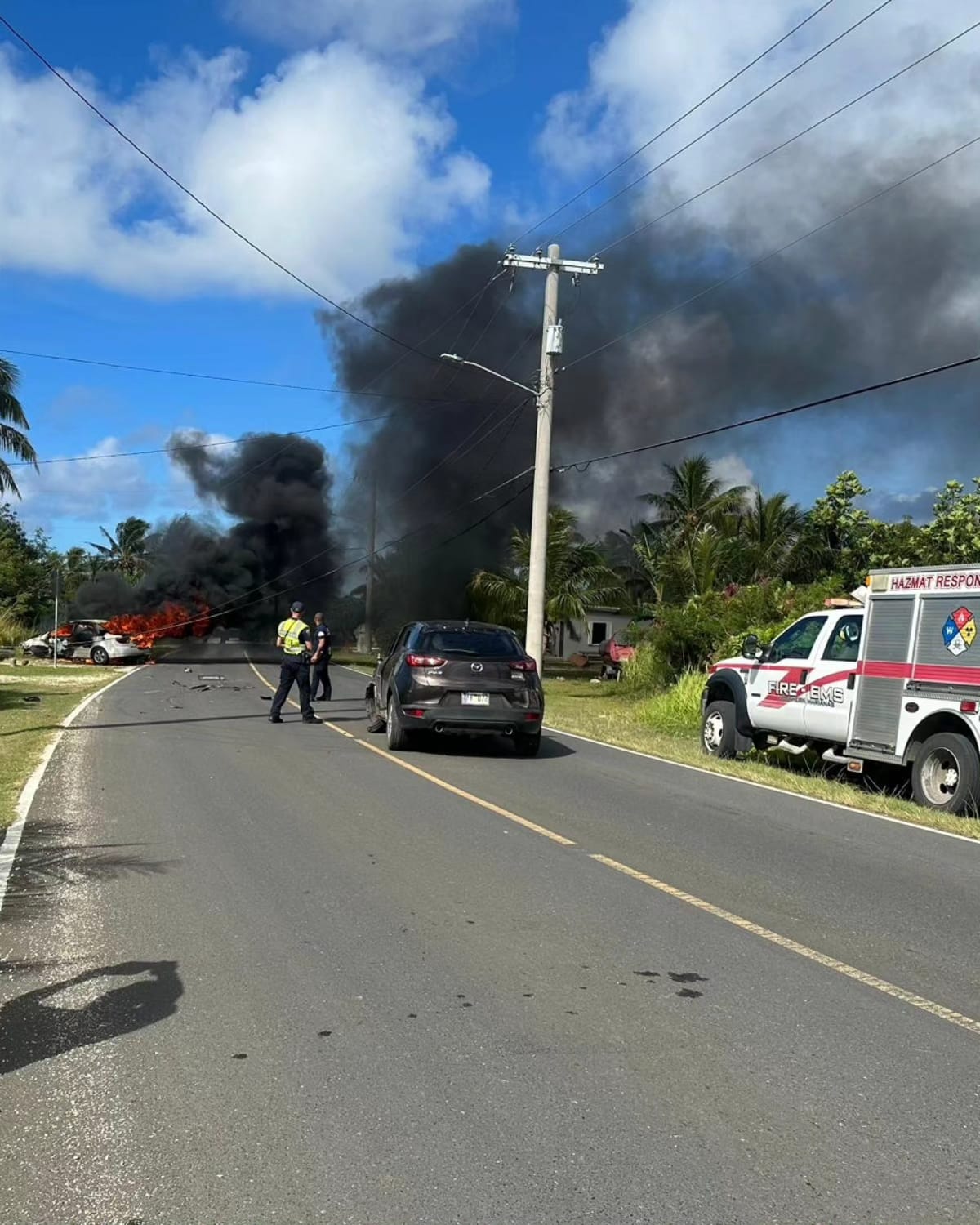 A white sedan caught fire after slamming into a power pole on Dandan’s main road, Thursday morning.