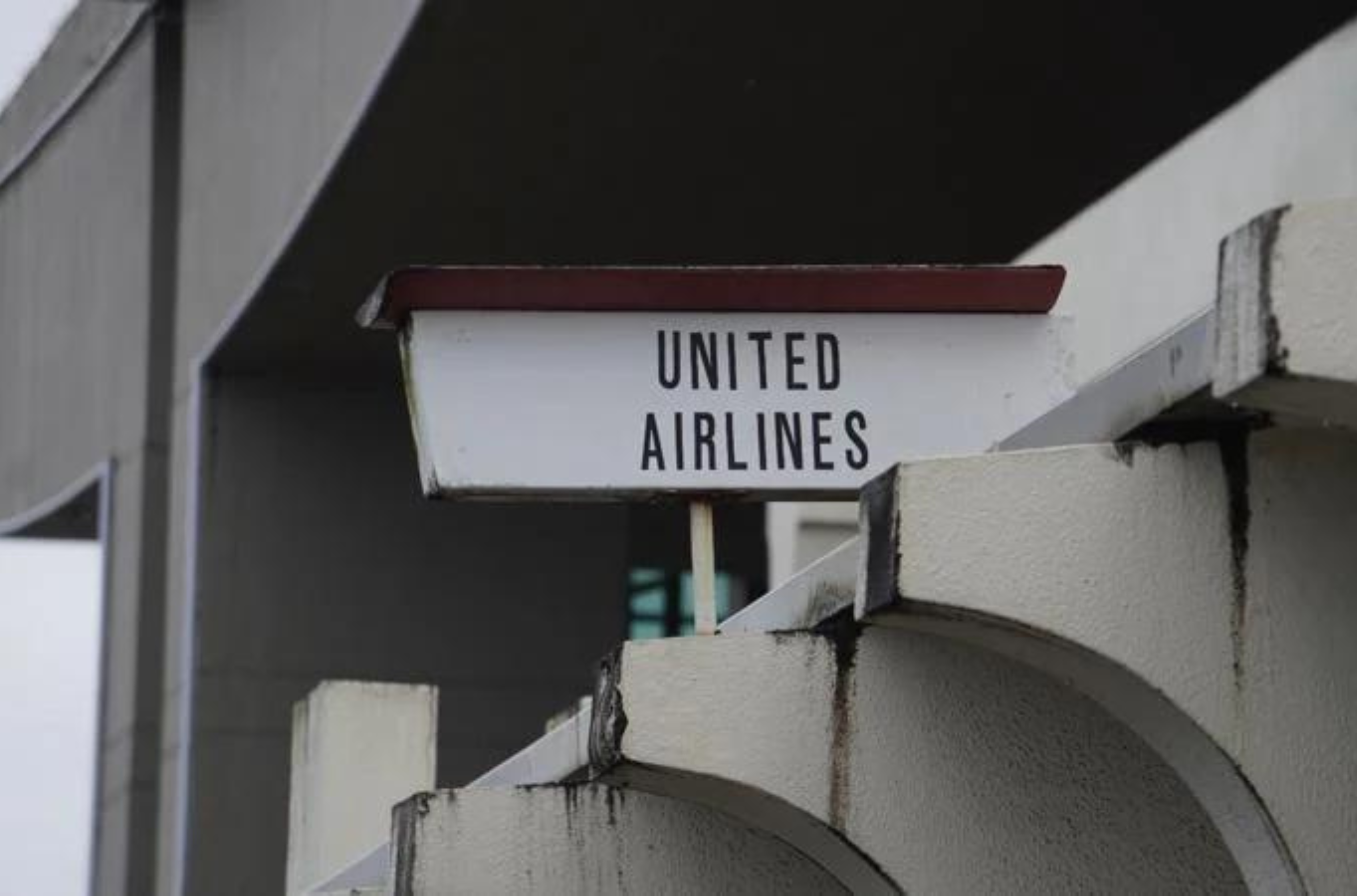 A United Airlines sign is seen outside of the departure terminal at the Antonio B. Won Pat International Airport in Tamuning on June 2, 2023.
