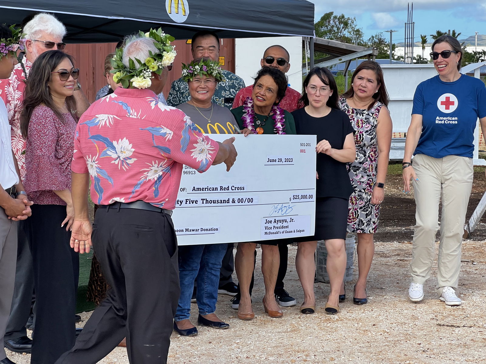 Joe C. Ayuyu Sr., president and owner/operator of McDonald’s of Guam and Saipan, presents a ceremonial check for $25,000 to the American Red Cross-Guam Chapter.