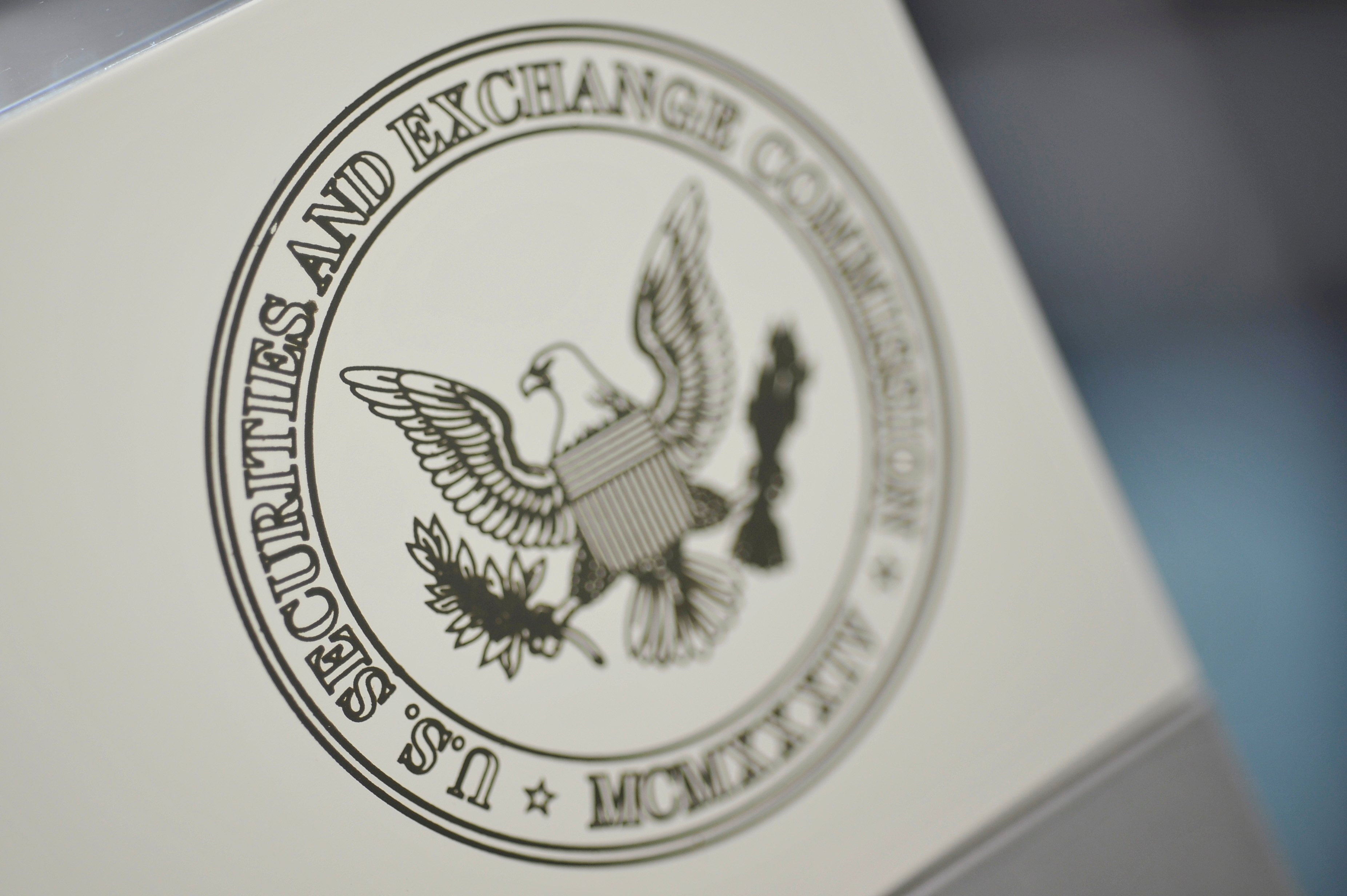 The U.S. Securities and Exchange Commission logo adorns an office door at the SEC headquarters in Washington, June 24, 2011. REUTERS/Jonathan Ernst/File Photo