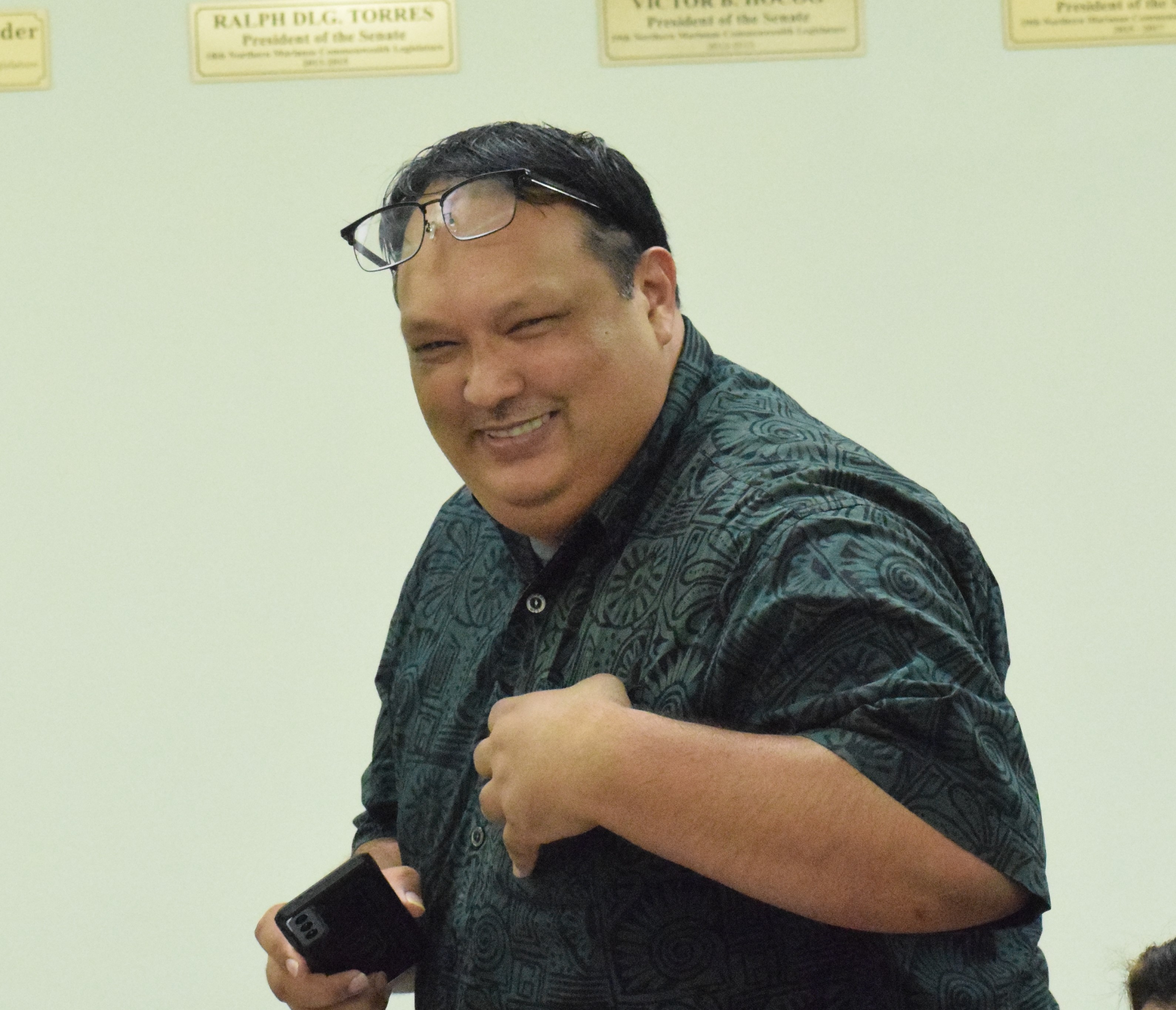 Office of Grant Management and State Clearinghouse Administrator Epiphanio Cabrera Jr. smiles during a meeting with the Senate Fiscal Affairs Committee on Thursday.