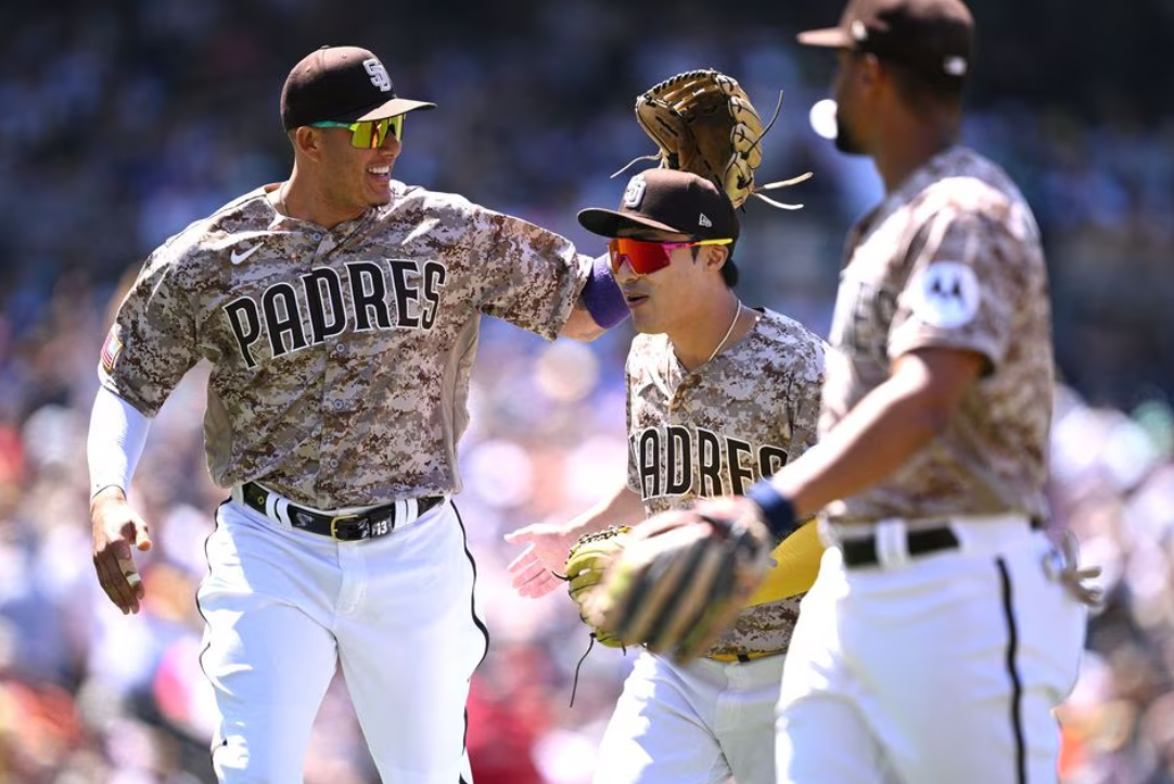 San Diego Padres third baseman Manny Machado (13) celebrates with second baseman Ha-seong Kim (7) after an inning-ending double play against the New York Mets in the sixth inning at Petco Park in San Diego, California, July 9, 2023.