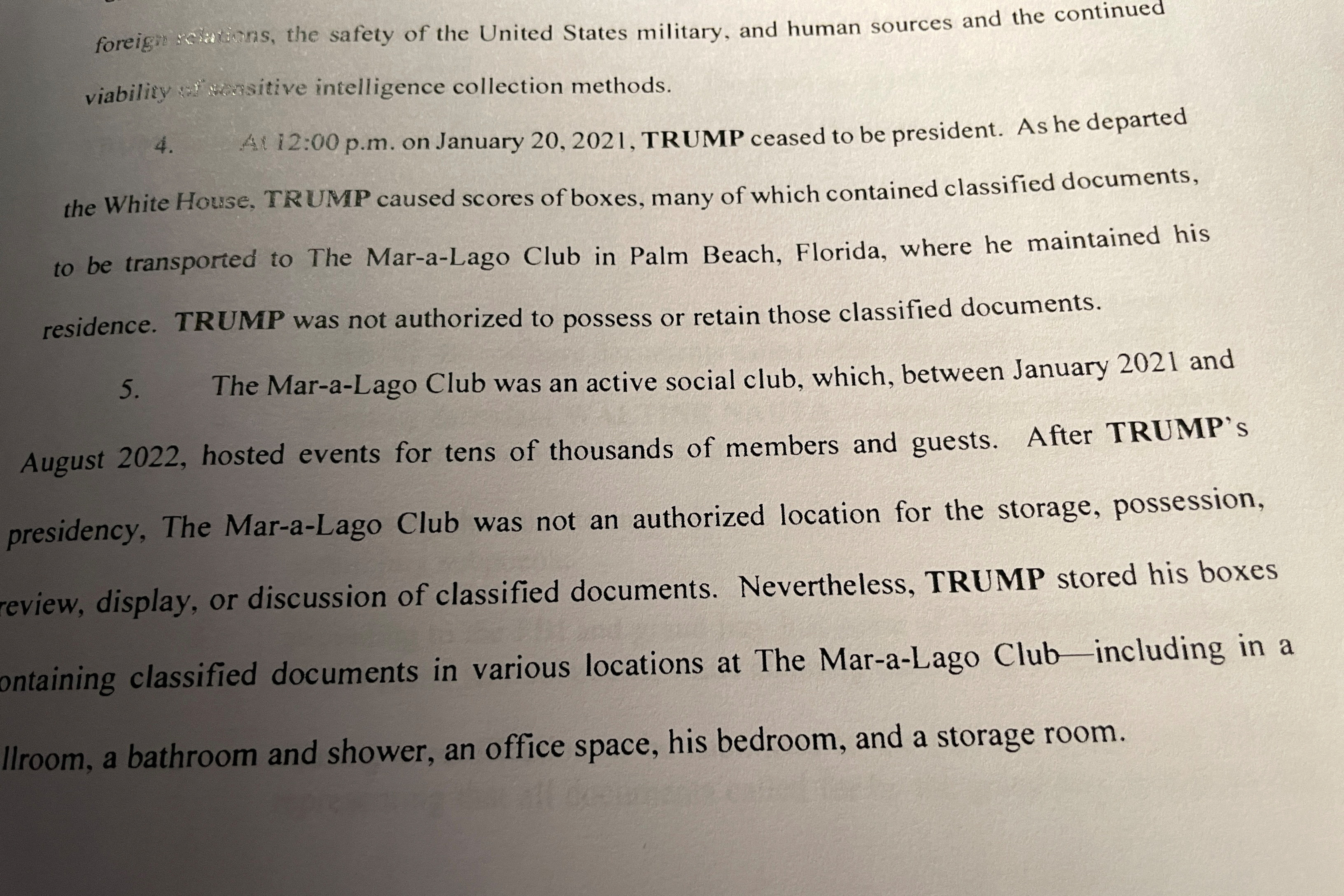 A page from a copy of a superceding indictment is seen, after U.S. prosecutors broadened their criminal case against Donald Trump as they charged a second of his employees with helping the former president evade officials who were trying to recover sensitive national security documents he took from the White House, in a photo illustration in Washington, U.S. July 27, 2023. REUTERS/Don Pessin/Illustration