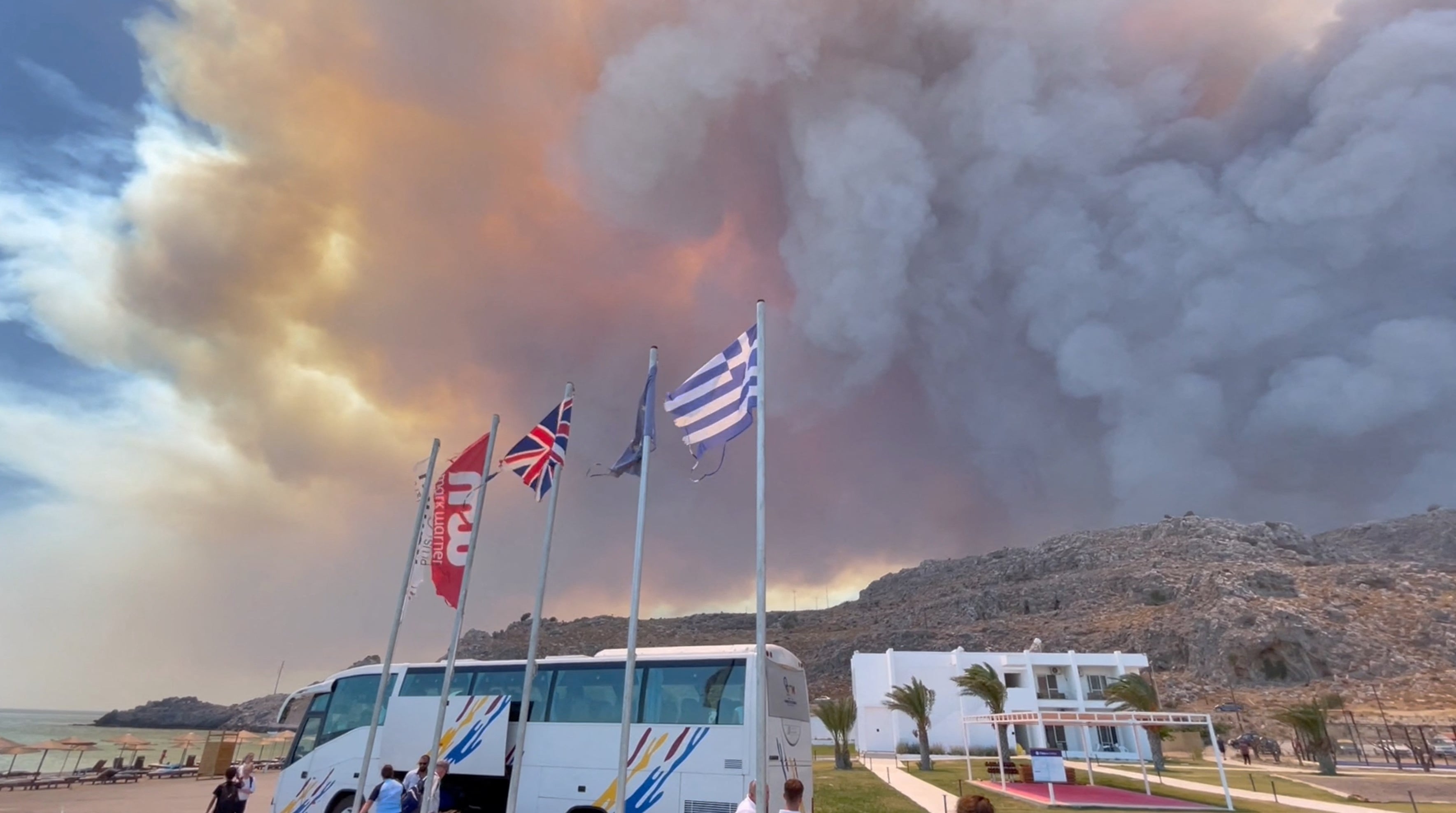 Smoke rises from a wildfire in Rhodes Island, Greece, July 22, 2023 in this screengrab taken from a social media video. Tiktok/@blairsbrainiacs/via REUTERS