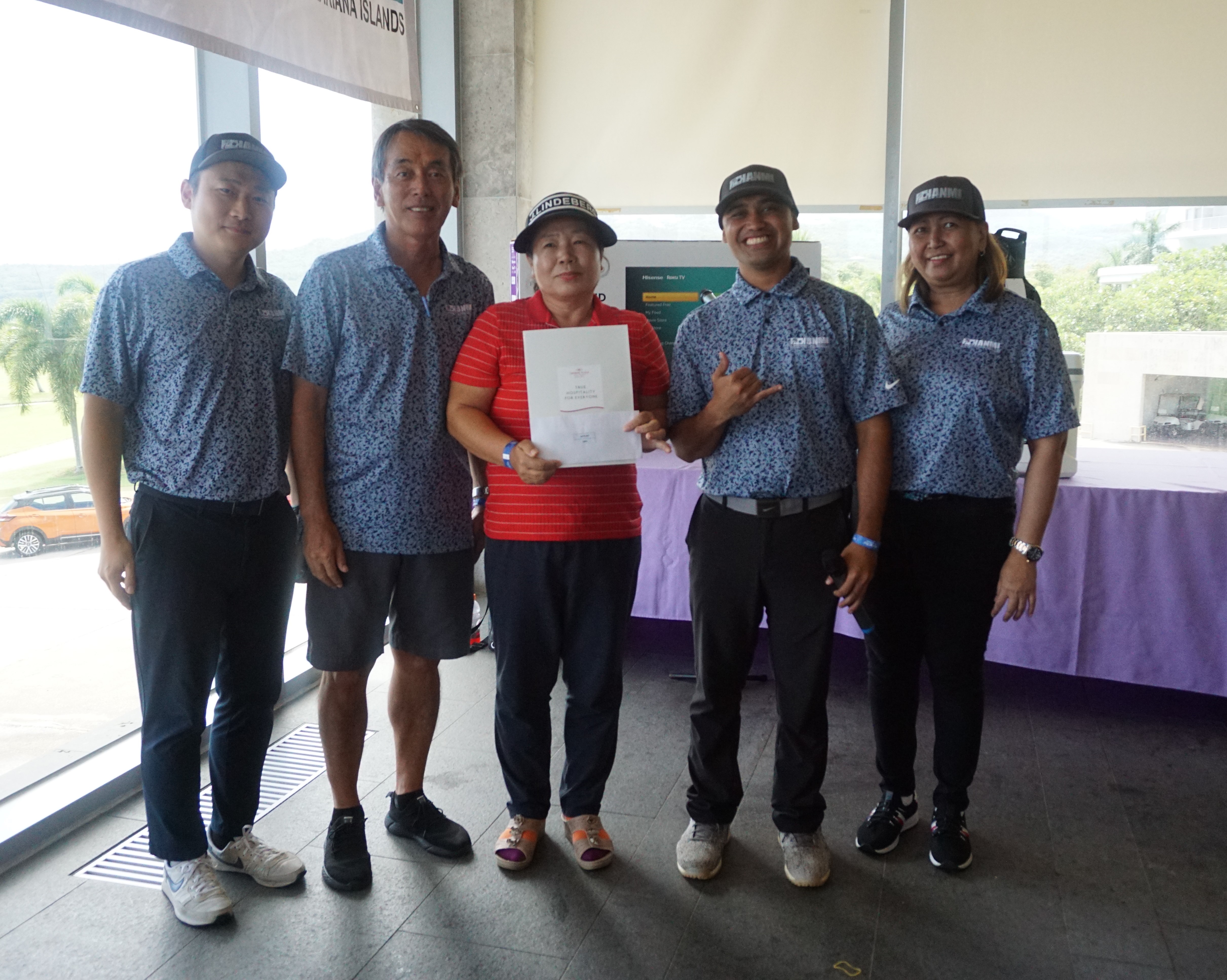 The 21st Annual HANMI Charity Classic Golf Tournament officers Seong-uk Jo, Juko Ishikawa, Franco Santos and Loida Sabanal pose with the winner, Me Ae Jeon, during the awards ceremony at the Laolao Bay Golf & Resort on Saturday.