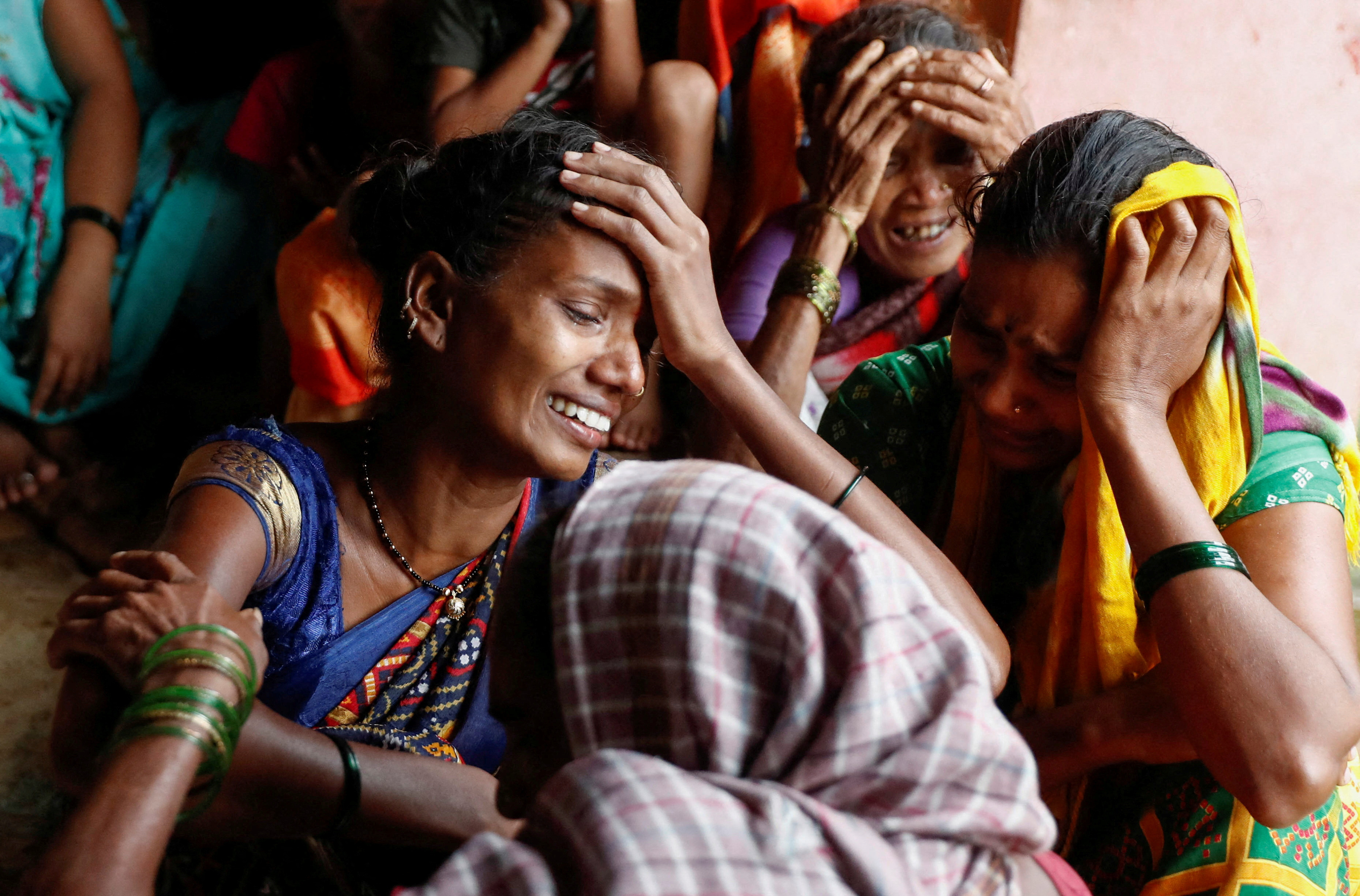 Women mourn the death of their relatives, after a landslide hit a village in Raigad, in the western Indian state of Maharashtra, India July 20, 2023. REUTERS/Francis Mascarenhas