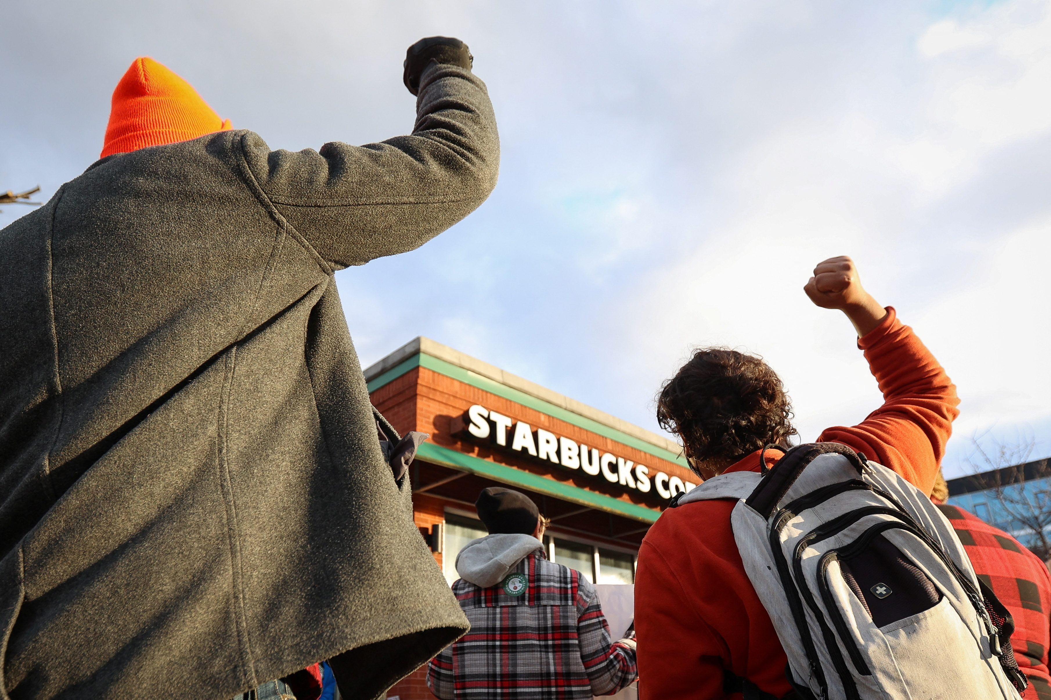 Starbucks workers attend a rally as they go on a one-day strike outside a store in Buffalo, New York, U.S., November 17, 2022. REUTERS/Lindsay DeDario