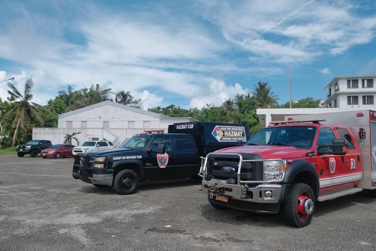 Guam Fire Department vehicles are seen Wednesday, July 12, 2023, near the Malojloj social hall in Inalåhan. 