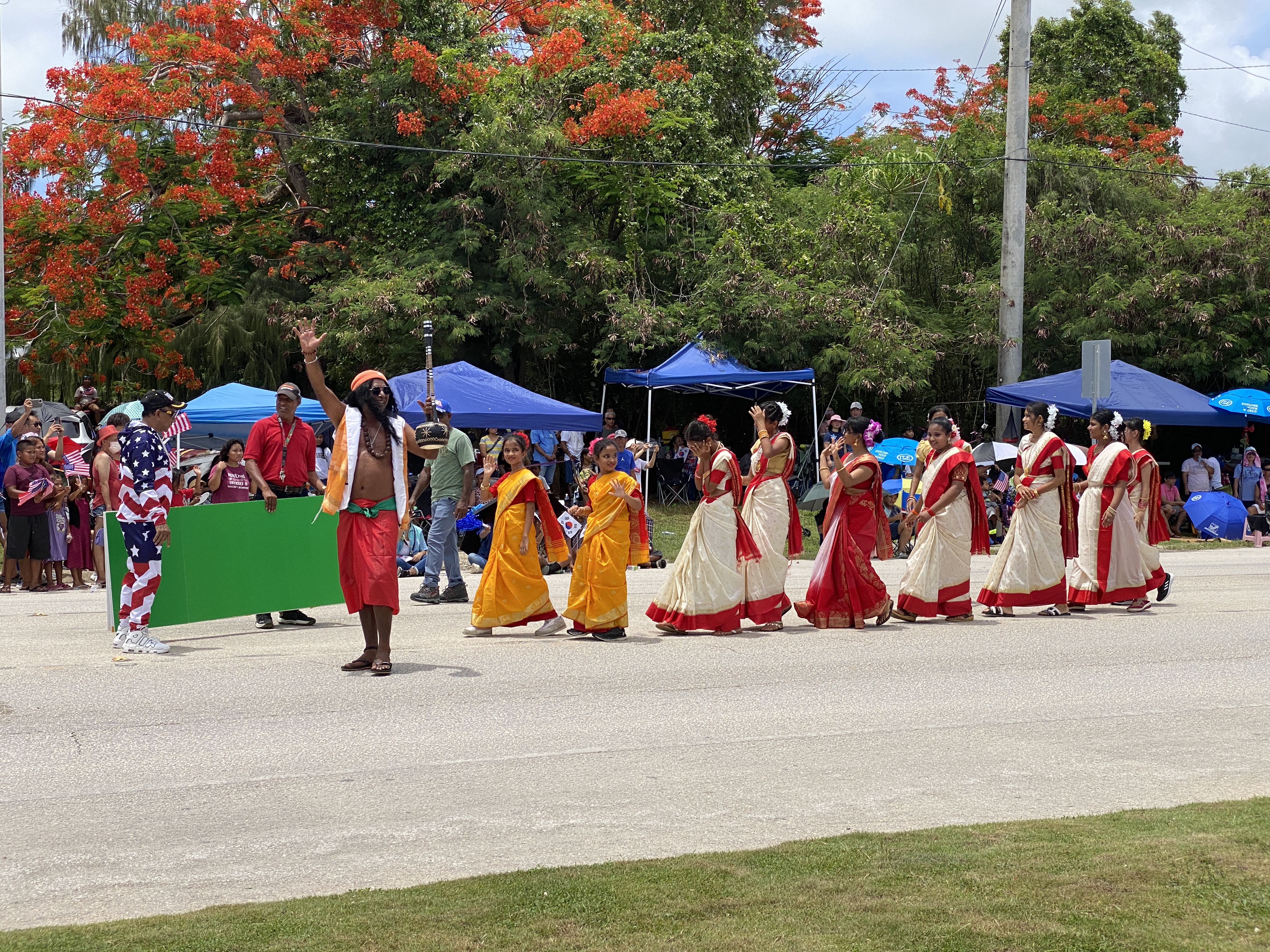 Dressed in their traditional costumes, members of the Bangladeshi community join the parade.