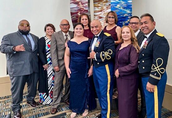 Chief Warrant Officer 4 Bernard Aguon, center, with his wife, Jennifer Aguon, and family, attends the National Adjutant General Ball in Columbia, S.C., June 15, 2023. Aguon is the first Guam Guardsman to be honored as a Distinguished Member of the AG Corps at the Hall of Fame for his work developing the Army's new human resources software platform.