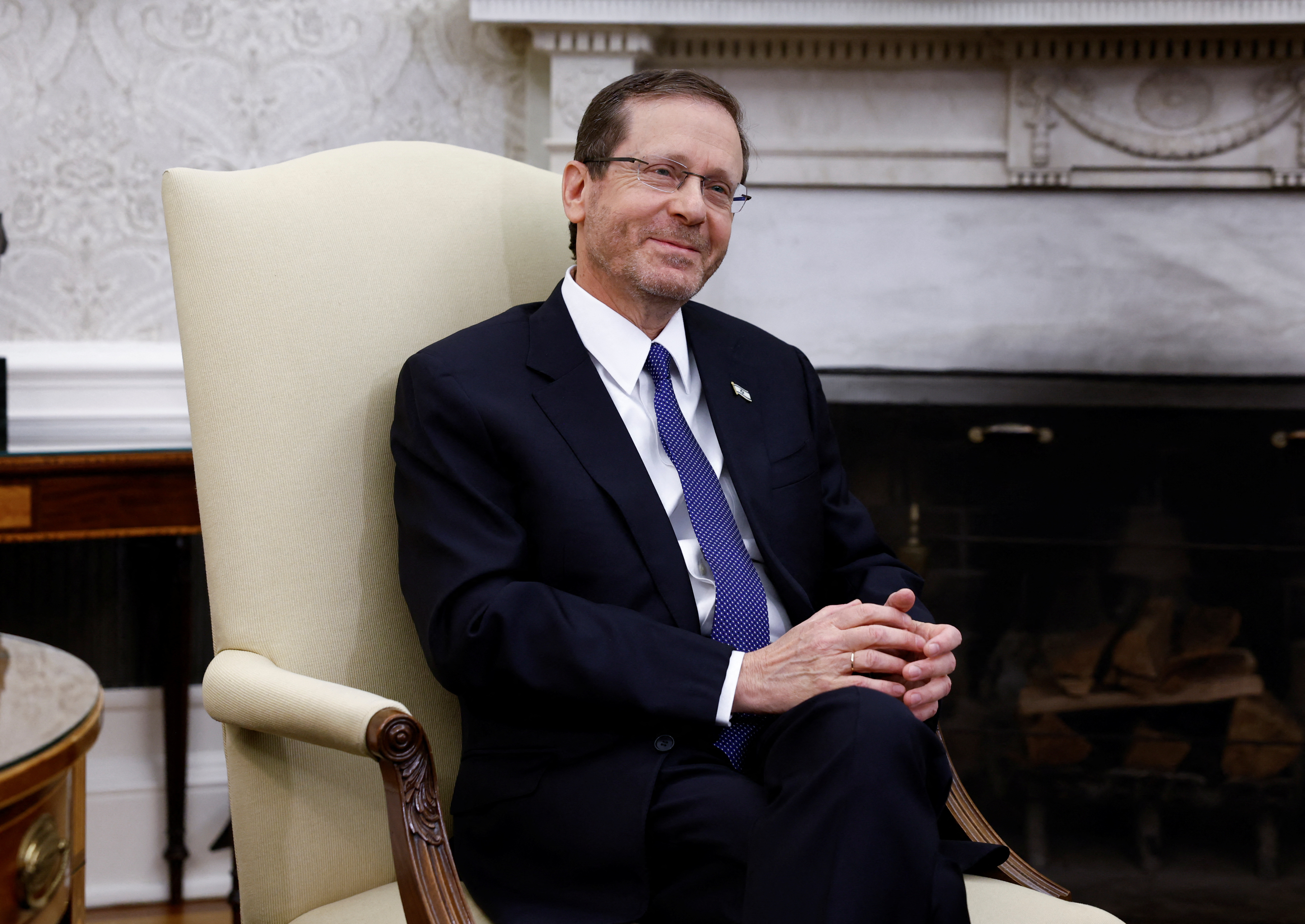 Israeli President Isaac Herzog listens during a meeting with U.S. President Joe Biden in the Oval Office at the White House in Washington, U.S., July 18, 2023. REUTERS/Evelyn Hockstein