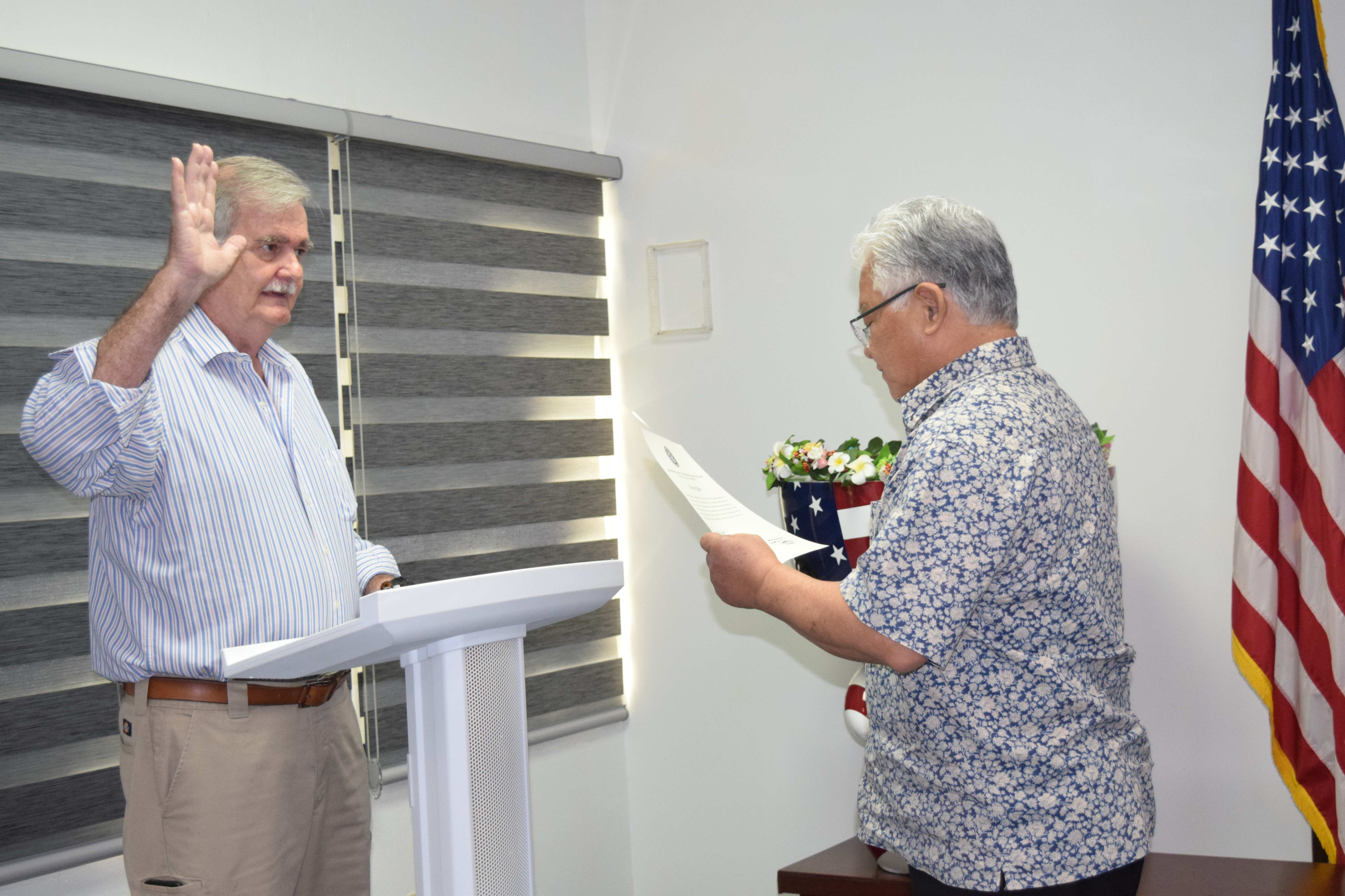 Gov. Arnold I. Palacios swears in Dr. John "Jack" Angello.