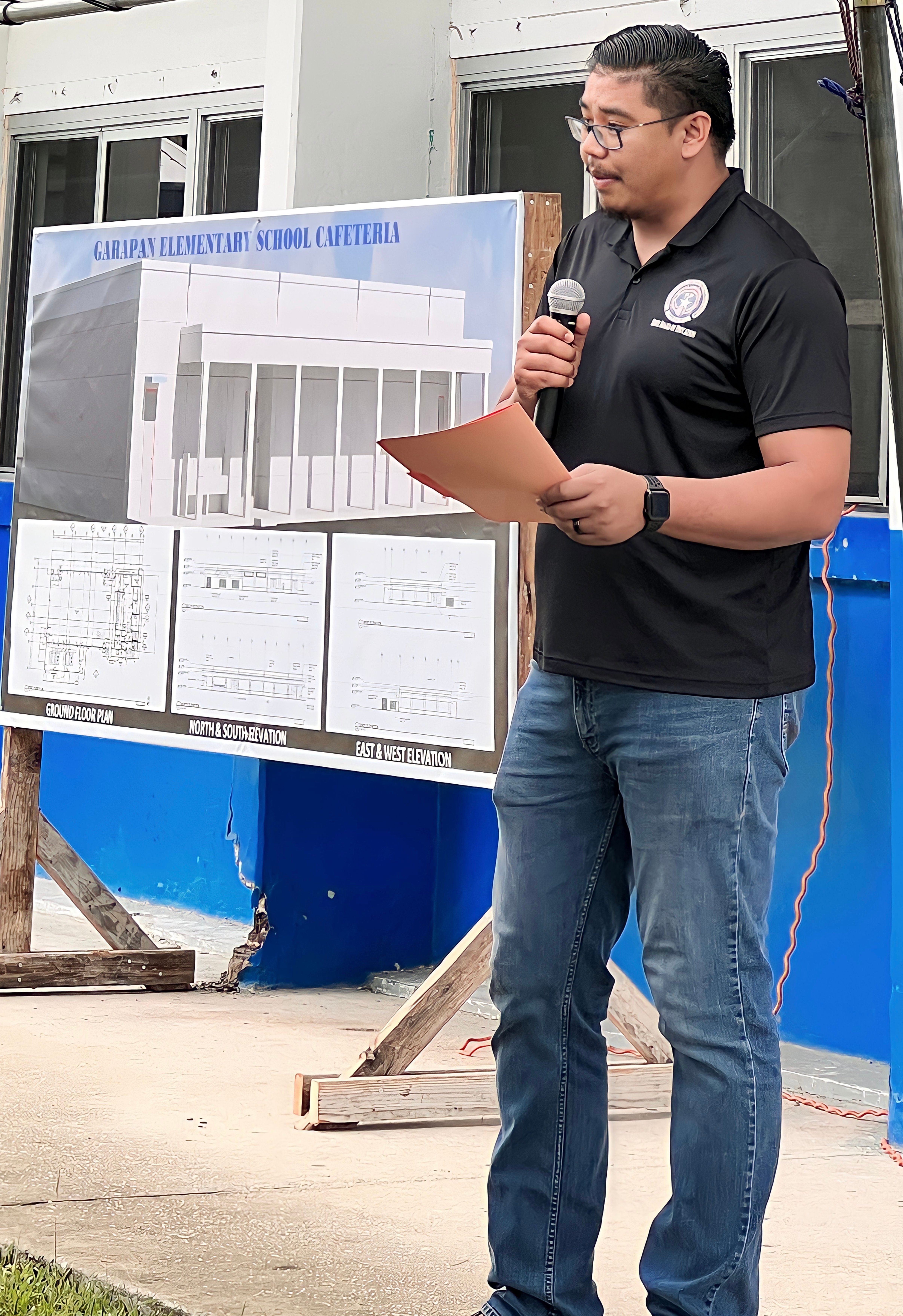  Board of Education Chairman Antonio L. Borja explains the importance of the new Garapan Elementary School cafeteria.