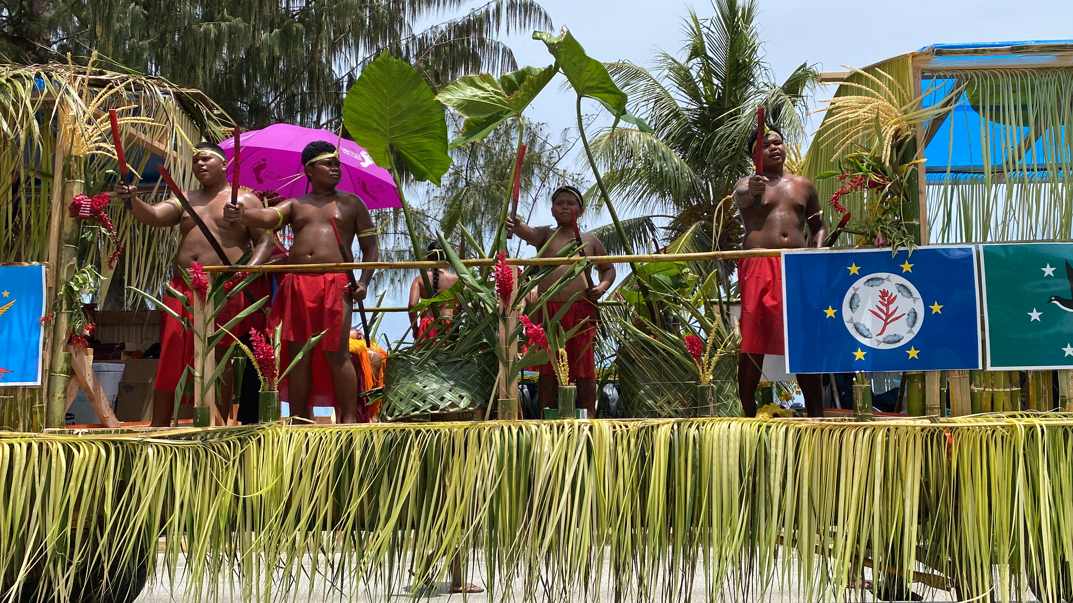Palauan dancers perform a warrior dance aboard the Palauan Community Association float.