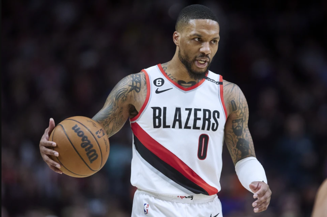 Portland Trail Blazers guard Damian Lillard brings the ball up against the New York Knicks during the second half of an NBA basketball game in Portland, Ore., Tuesday, March 14, 2023.