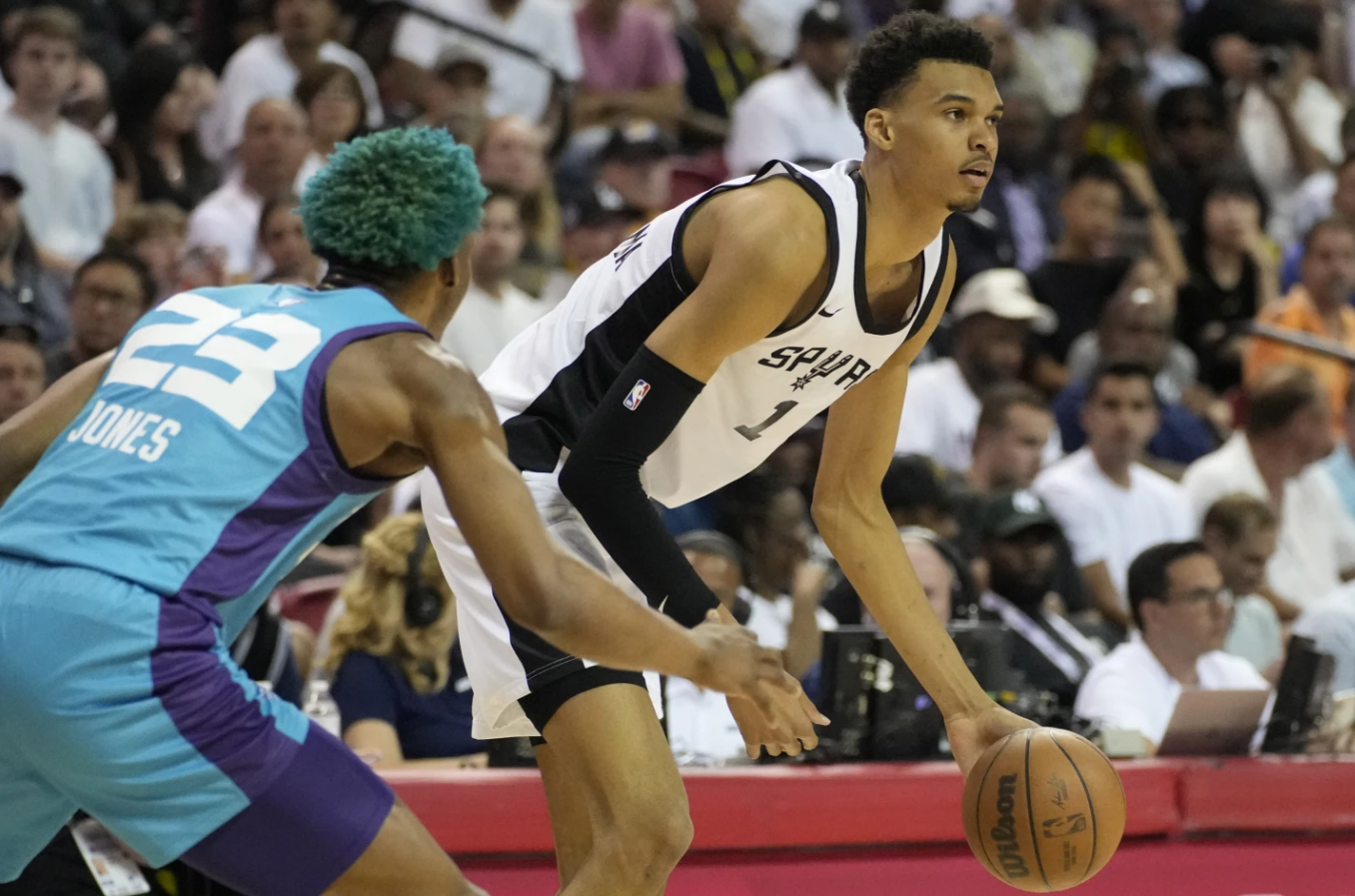 San Antonio’s Victor Wembanyama drives against Charlotte Hornets’ Kai Jones during the first half of an NBA summer league basketball game Friday, July 7, 2023, in Las Vegas.