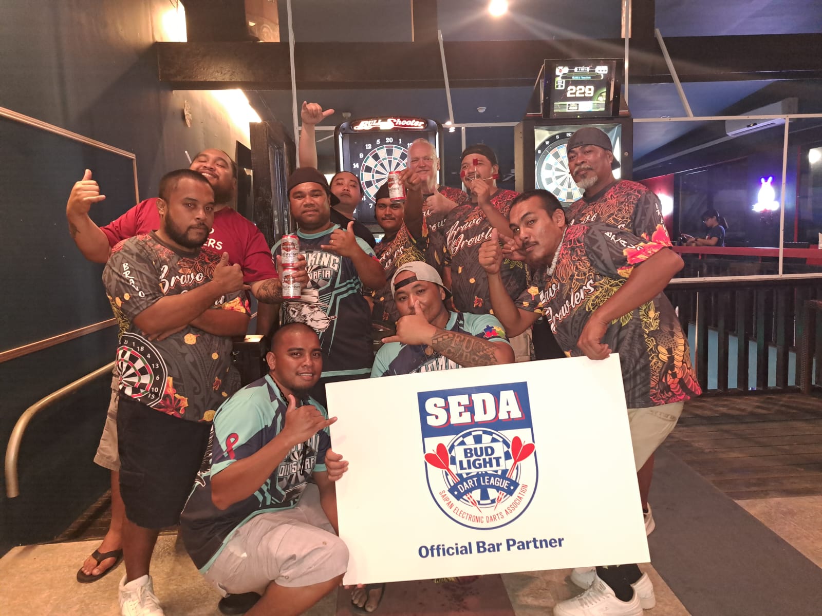 The Black8 Smokin Dart Mafia and the Bravo Prowlers pose for a photo after their game in the Chichirika C Division of the 2023 SEDA Bud Light Dart League on Wednesday at Black 8 Pool Bar.