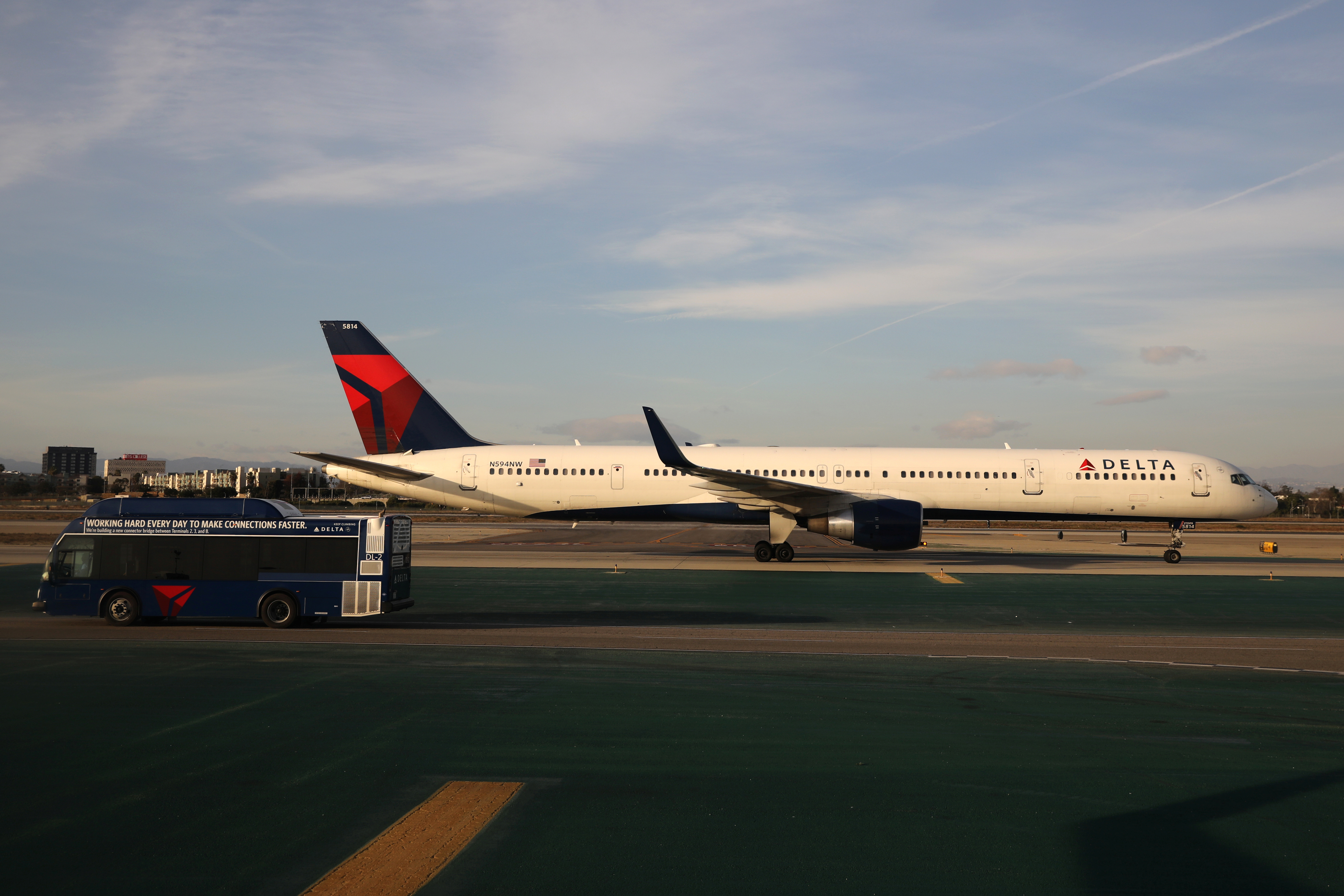 A Delta plane passes a Delta bus on the tarmac at LAX airport in Los Angeles, California U.S. January 10, 2018. REUTERS/Lucy Nicholson/File Photo