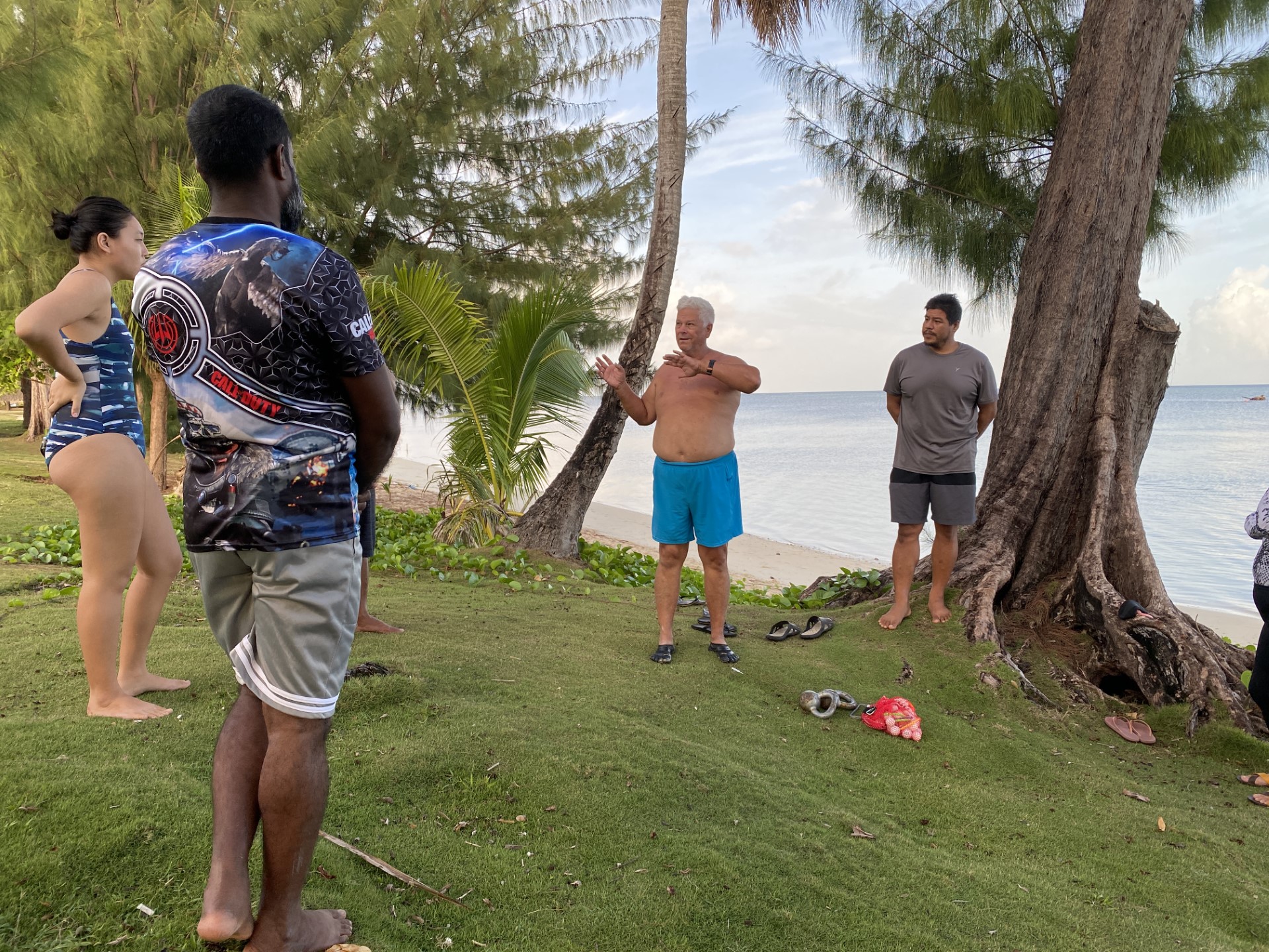 Roy Adsit, center, and Jeremiah Benavente, right, conduct lifeguard training at the 500 Sails-Guma Sakman Beach.
