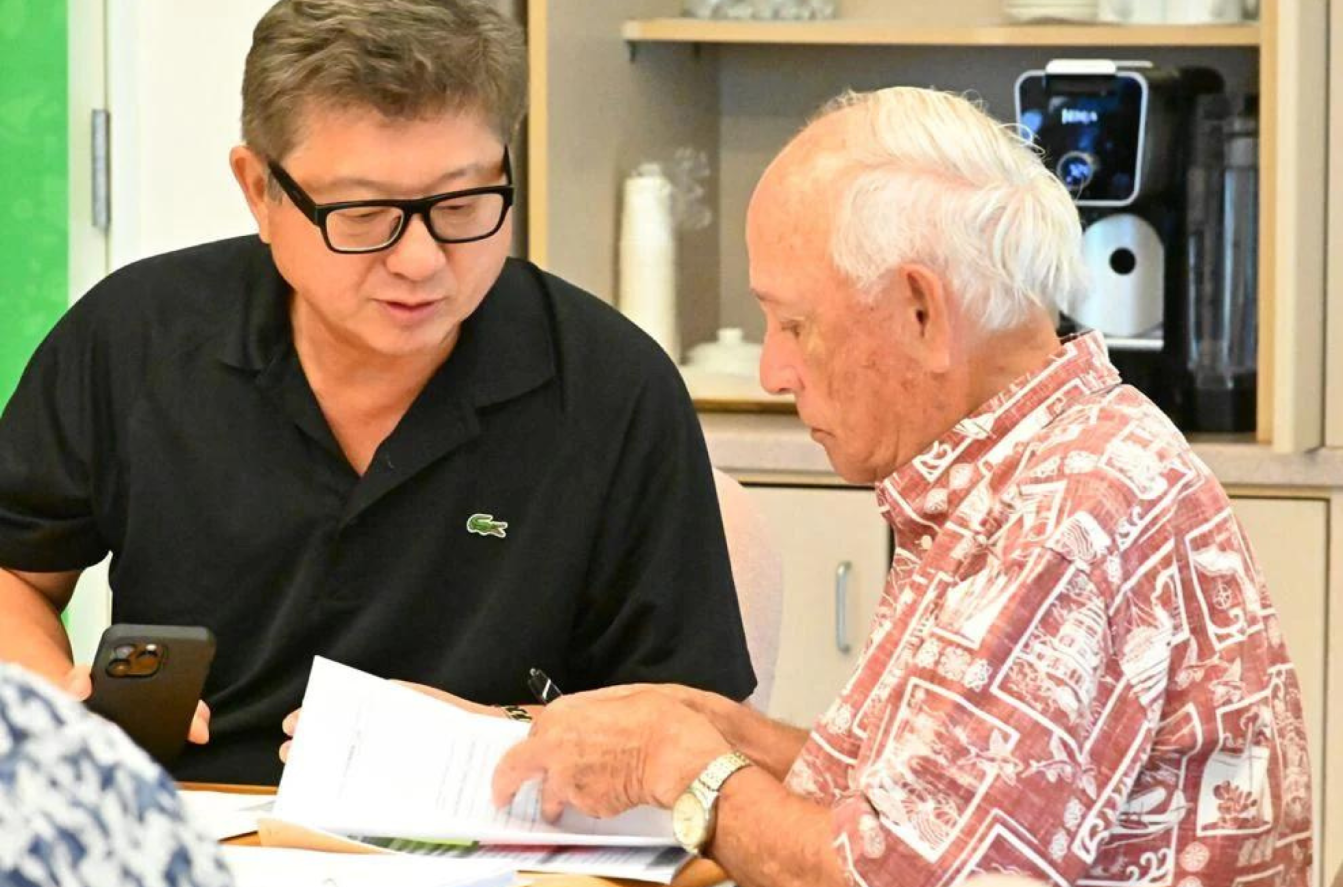 George Chiu, Guam Visitors Bureau board chairman, left, and Carl Gutierrez, GVB president and CEO, talk during the regular monthly GVB board meeting Thursday, July 13, 2023, in Tumon. 