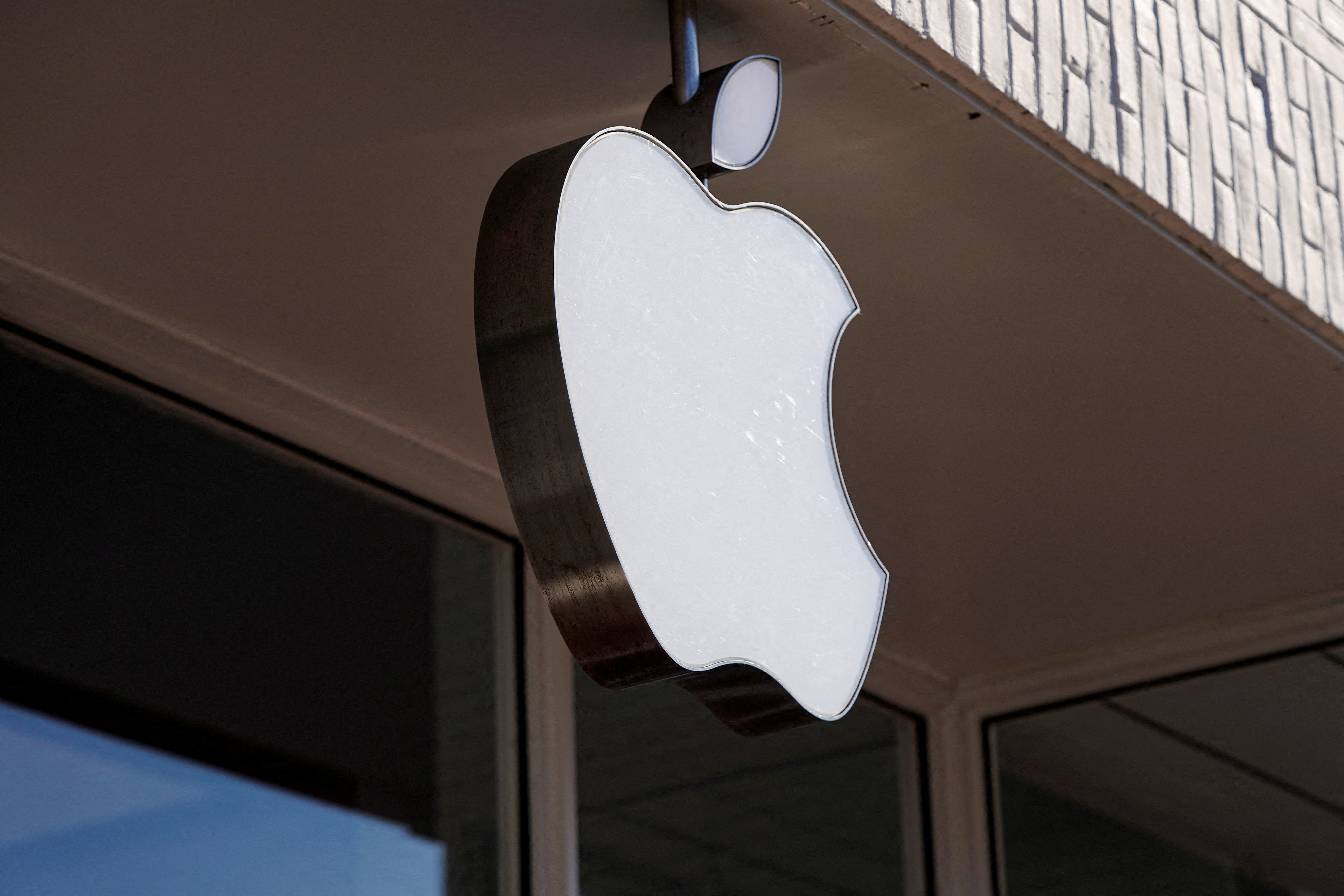 FILE PHOTO: Logo of an Apple store is seen as Apple Inc. reports fourth quarter earnings in Washington, U.S., January 27, 2022. REUTERS/Joshua Roberts/File Photo