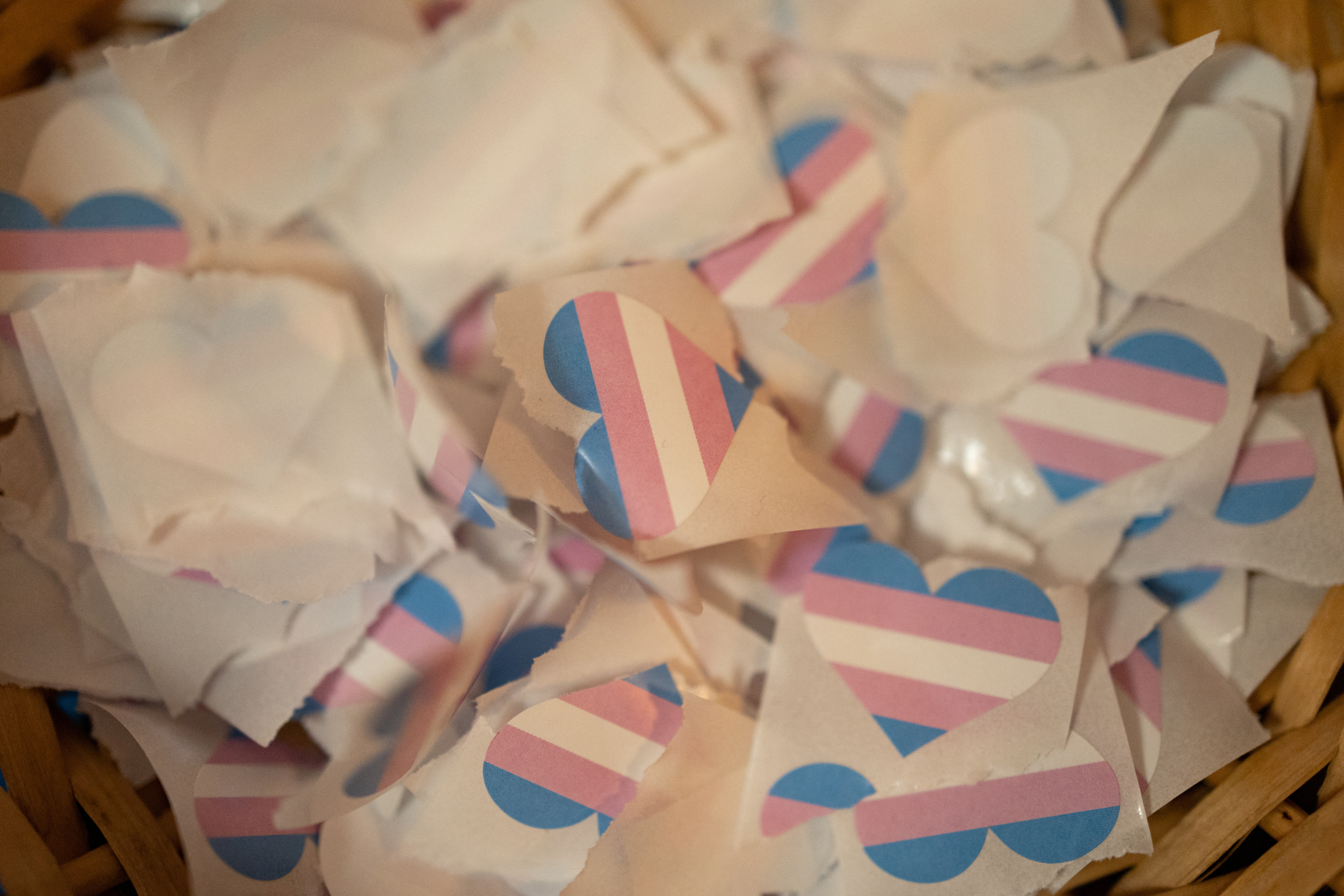 Stickers in the shape of a heart with a trans flag are pictured during a conversation about trans care, equity and access, during National Trans Visibility Month with the Rainbow Room, a program of Planned Parenthood Keystone, in Doylestown, Pennsylvania, U.S., March 29, 2023. REUTERS/Hannah Beier/File Photo