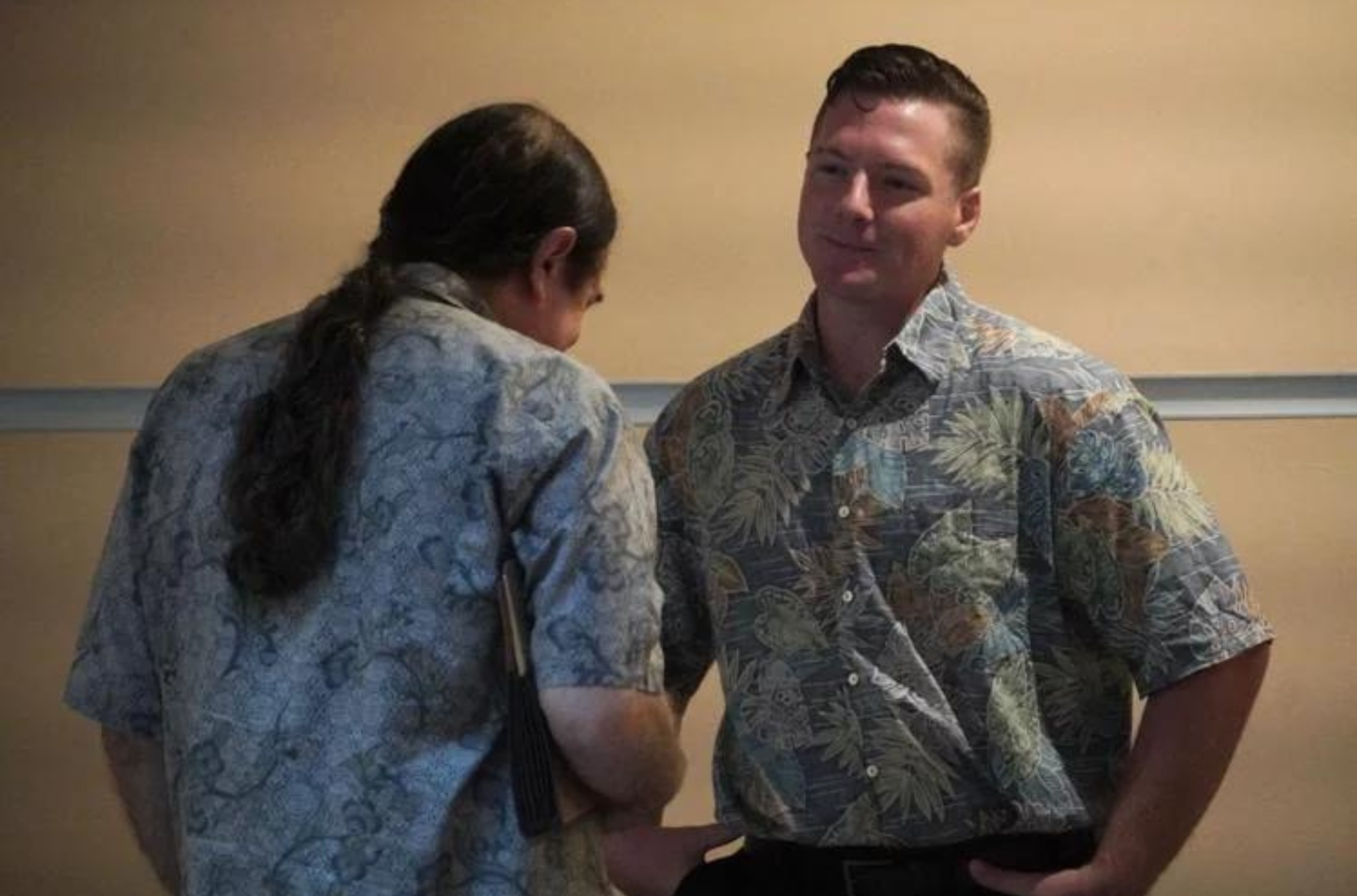 Nicholas Moore, right, speaks with his attorney, Michael Phillips, before a hearing in the Superior Court of Guam on Thursday morning, July 13, 2023. 