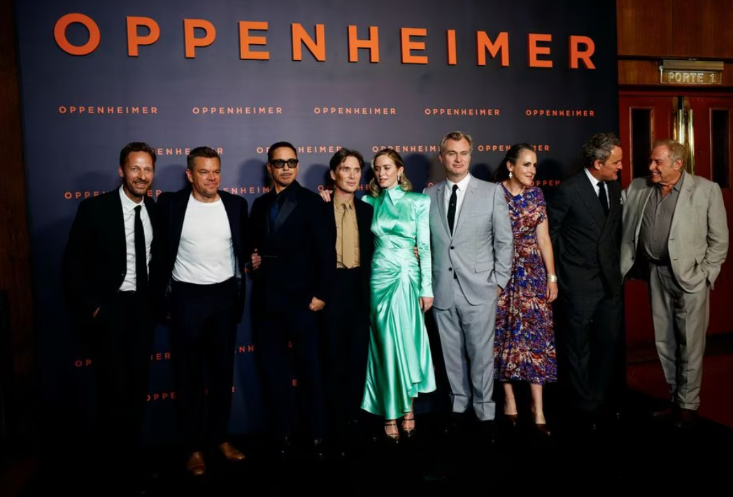 Cast members Trond Fausa Aurvag, Matt Damon, Robert Downey Jr., Cillian Murphy, Emily Blunt, Jason Clarke, Director Christopher Nolan, his wife Emma Thomas, and Producer Charles Roven pose during a photocall before the premiere of the film "Oppenheimer" at the Grand Rex in Paris, France, July 11, 2023.