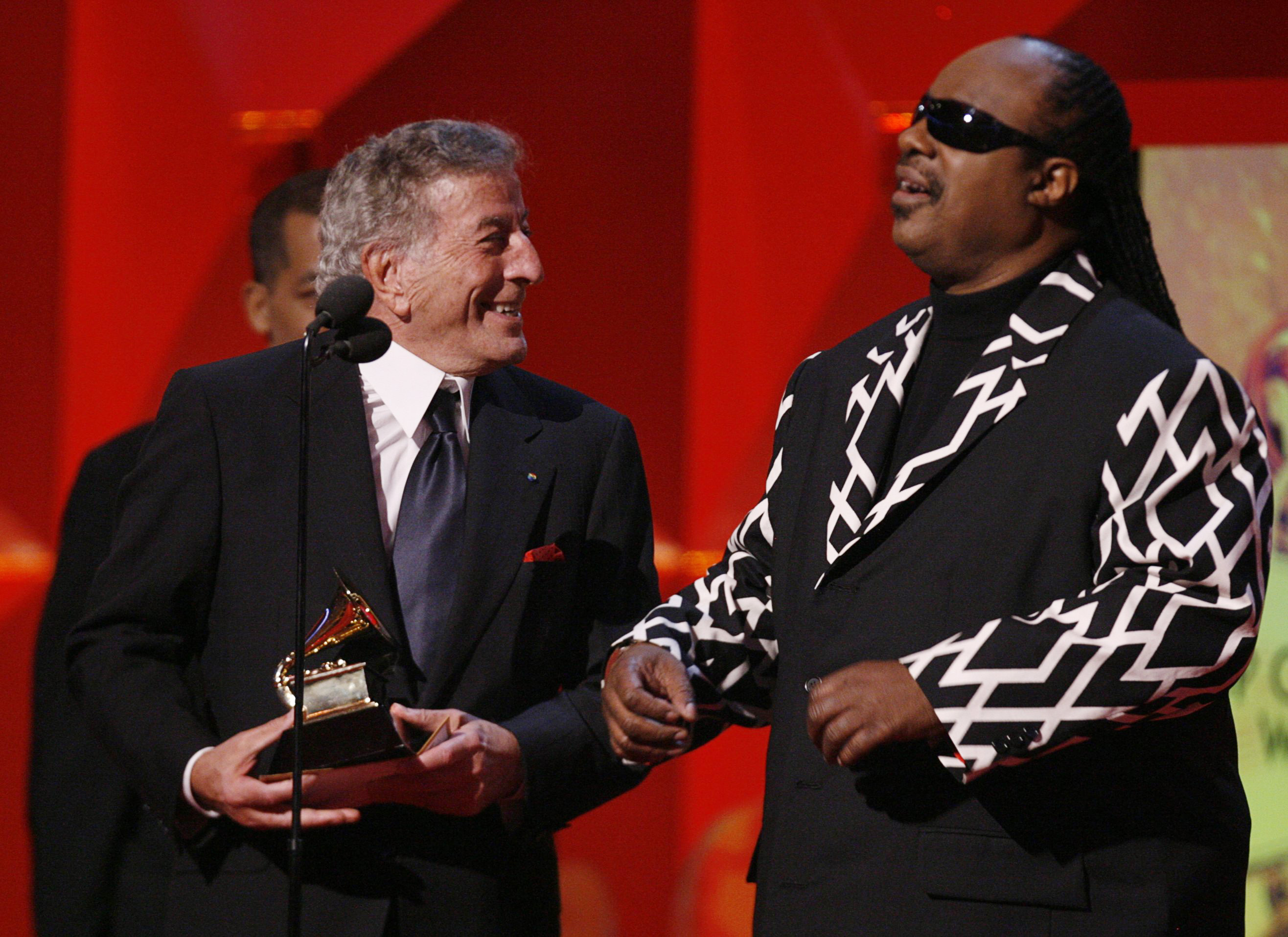 FILE PHOTO: Tony Bennett (L) and Stevie Wonder accept the Grammy for Best Pop Collaboration With Vocals for "For Once In My Life" at the 49th Annual Grammy Awards in Los Angeles February 11, 2007. REUTERS/Lucy Nicholson (UNITED STATES)/File Photo