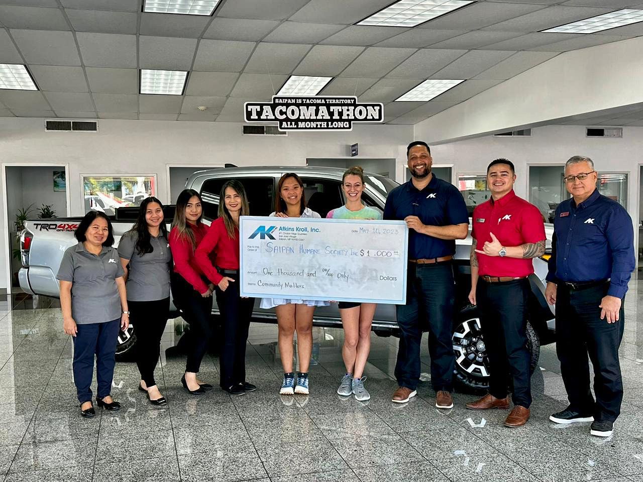 Atkins Kroll Toyota's Asun Demapan, Jenealyn Umbay Kim Calage and Liza Taylor with Saipan Humane Society Director Ruby Ma, SHS founding member Lauren Cabrera, Atkins Kroll Toyota Saipan Sales Manager Kevin Barnes, Kevin Ada and Joaquin Blanco.
